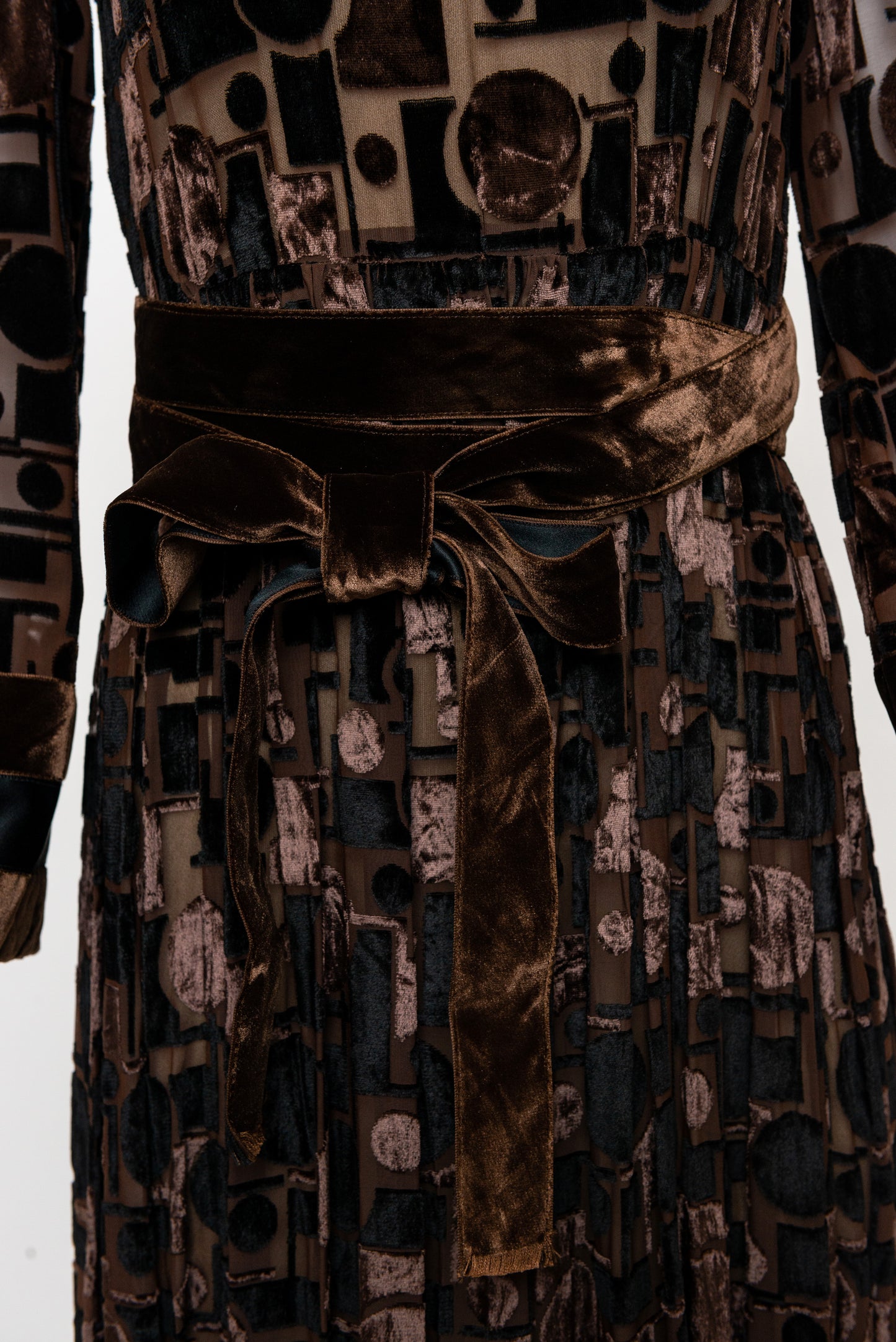 Patterned dress with a belt on a white background