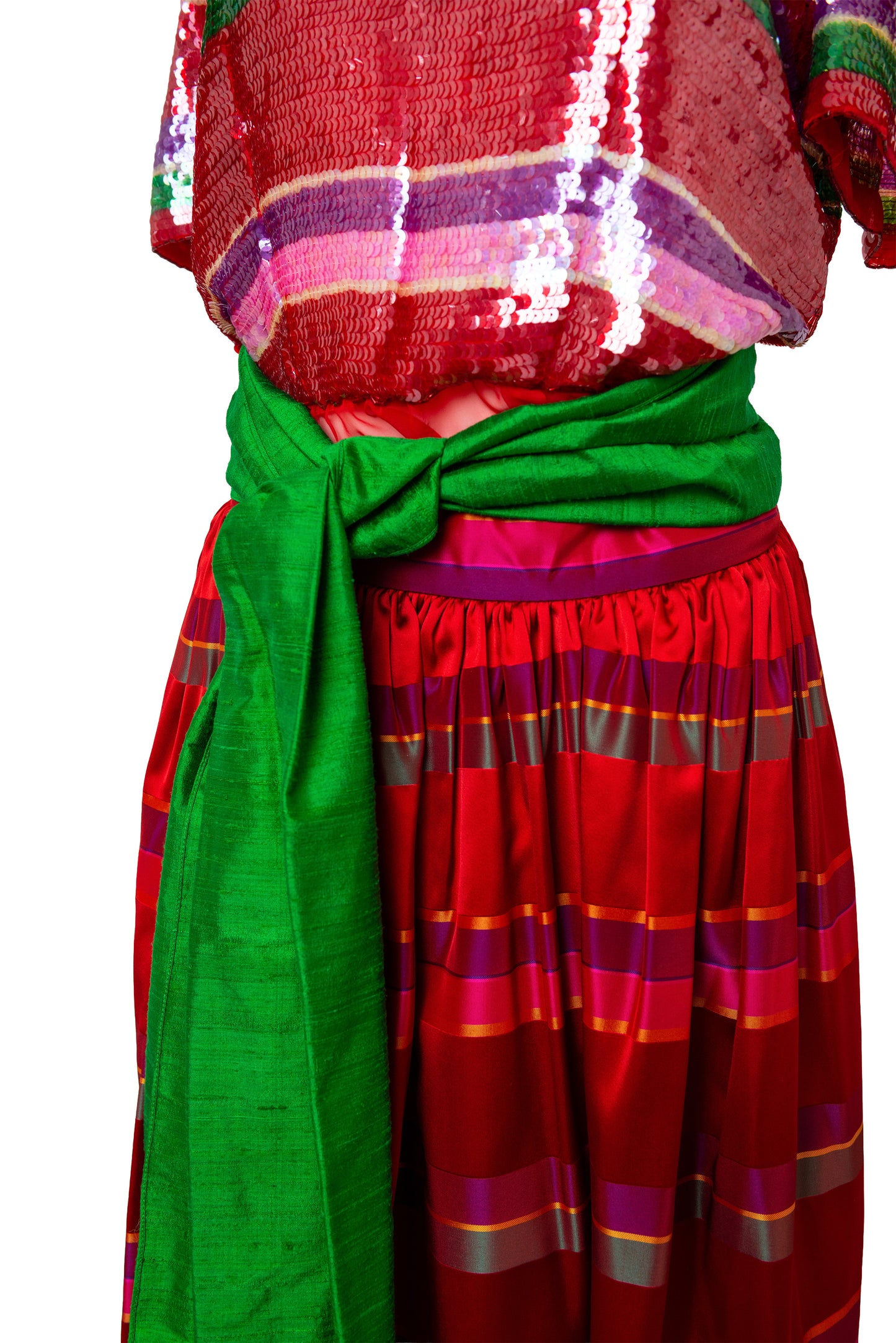 Traditional outfit with a red and green patterned dress on a white background