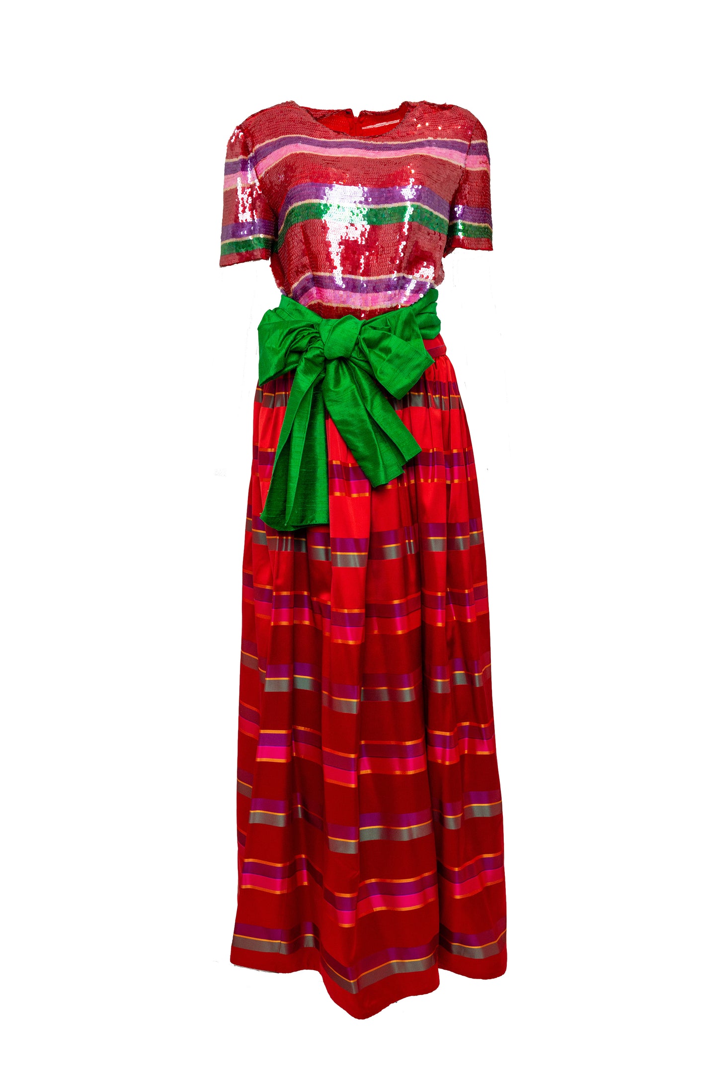 Red and green patterned dress with a green bow on a white background