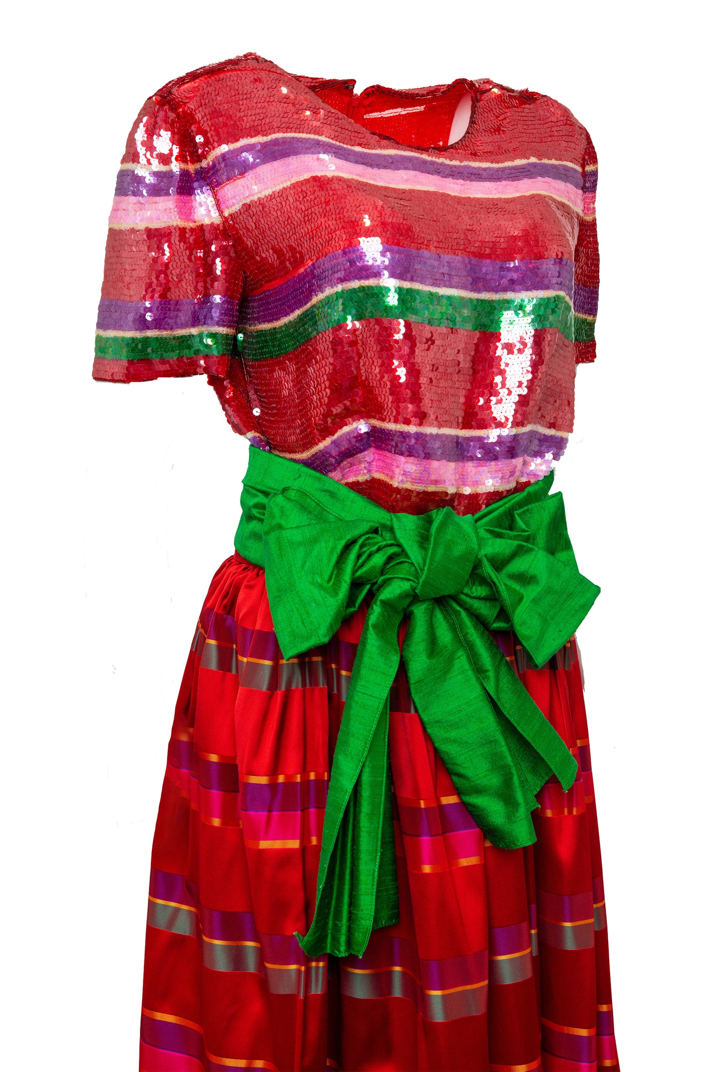 Red dress with colorful stripes and a green bow on a white background