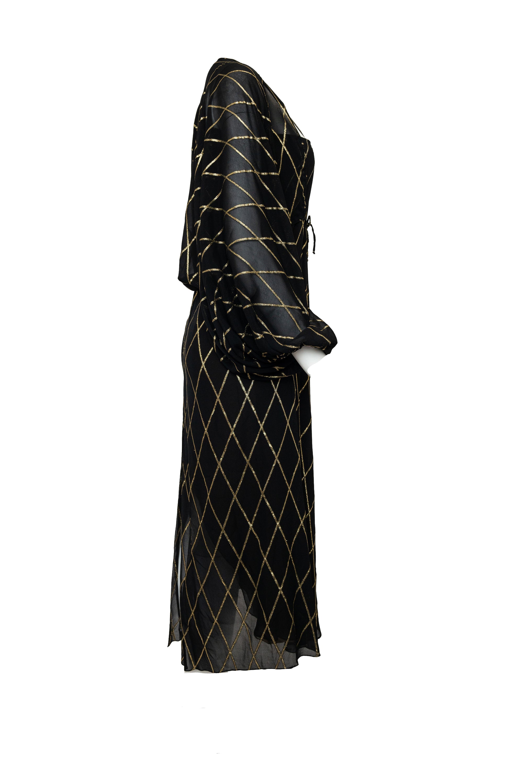 Black dress with gold geometric pattern on a white background