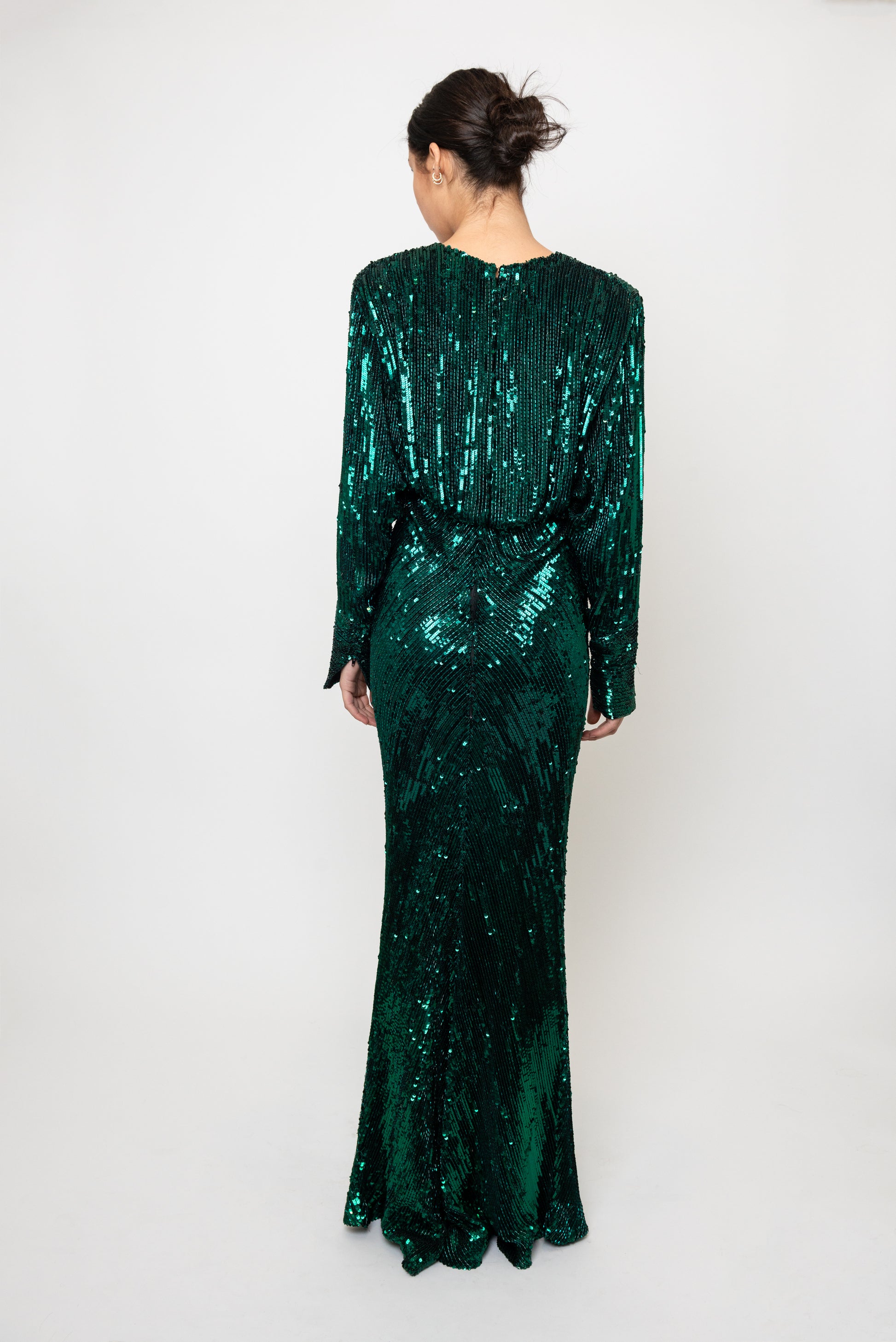 Green Bob Mackie sequin dress worn by a person on a white background