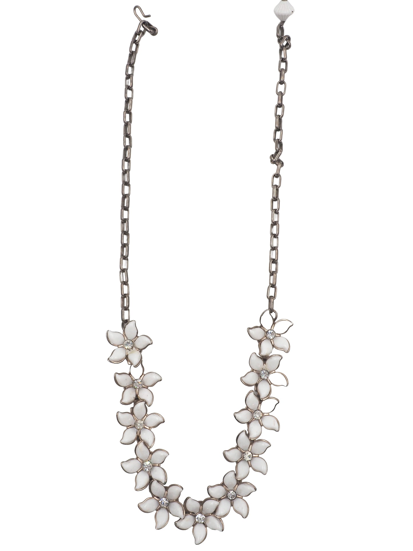 A vintage bridal silver-tone chain necklace featuring a row of white enamel flower blossoms with small clear rhinestone accents