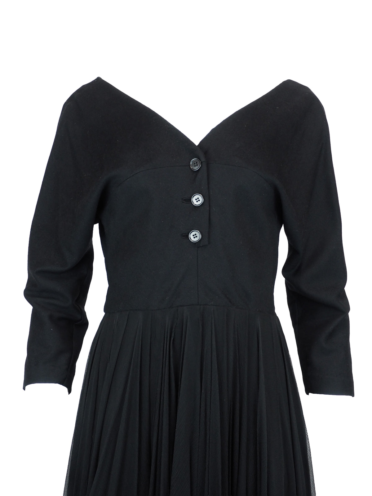 A vintage galanos black long-sleeve midi dress with a V-neckline, three-quarter button placket, and a pleated chiffon skirt