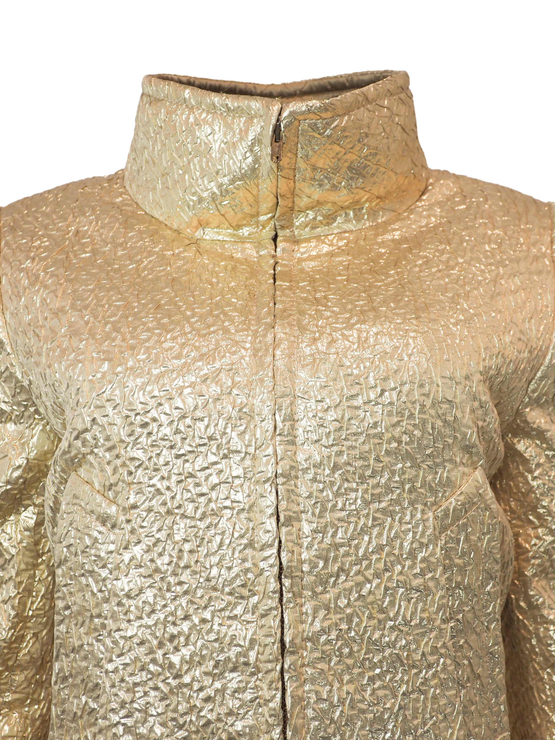 A vintage James galanos metallic gold textured coat with a high stand collar, front zipper, and side pockets