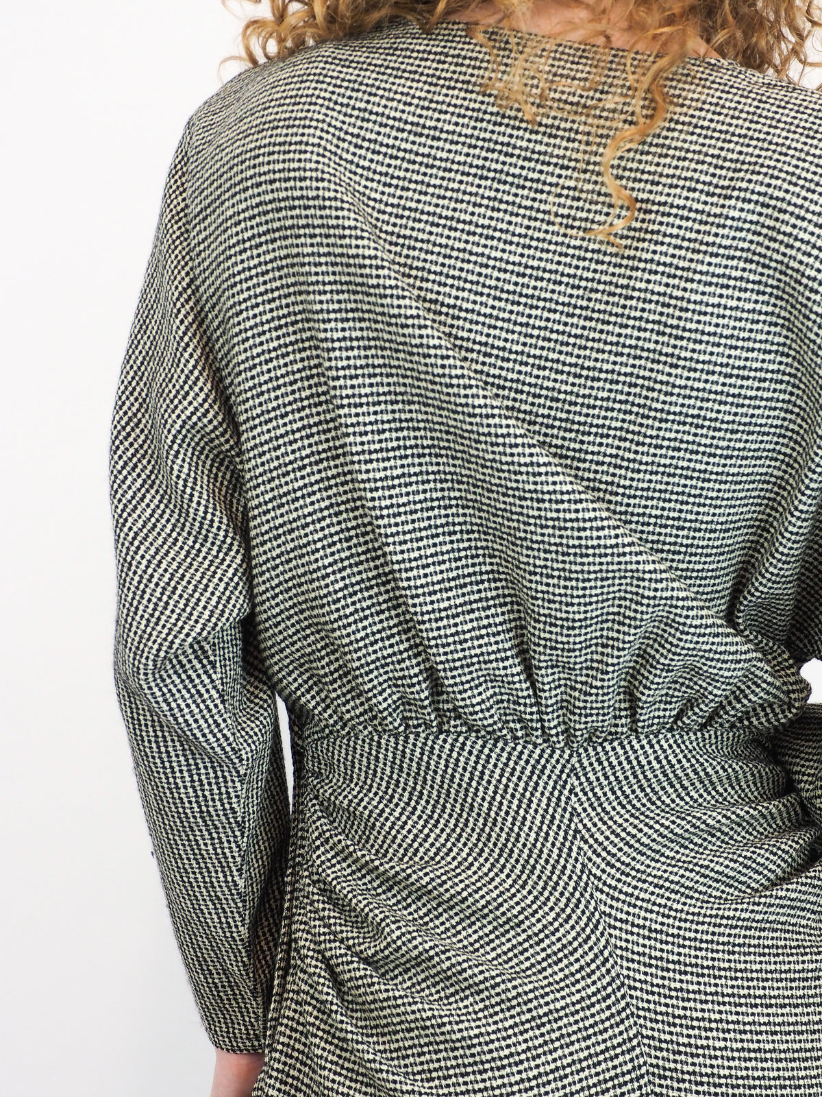 A vintage houndstooth Gucci 1980s checkered mini dress with buttons and a center cut out