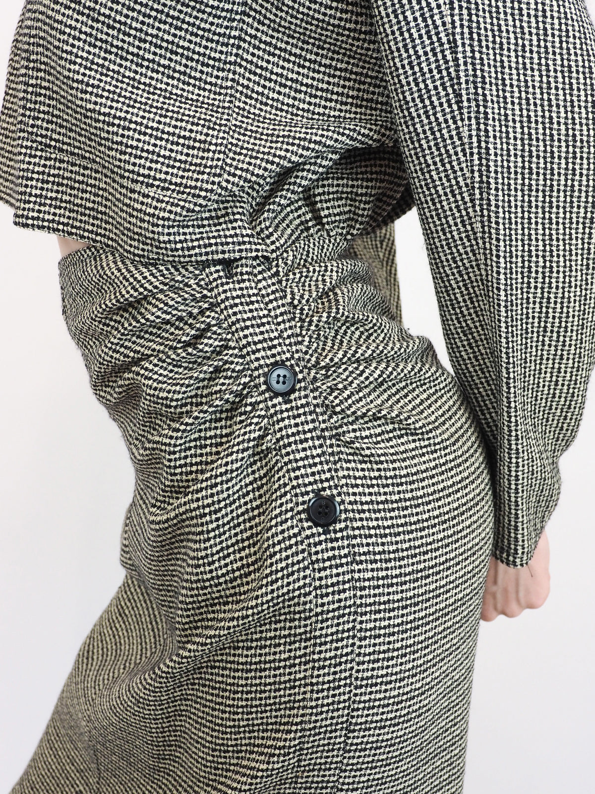 A vintage houndstooth Gucci 1980s checkered mini dress with buttons and a center cut out
