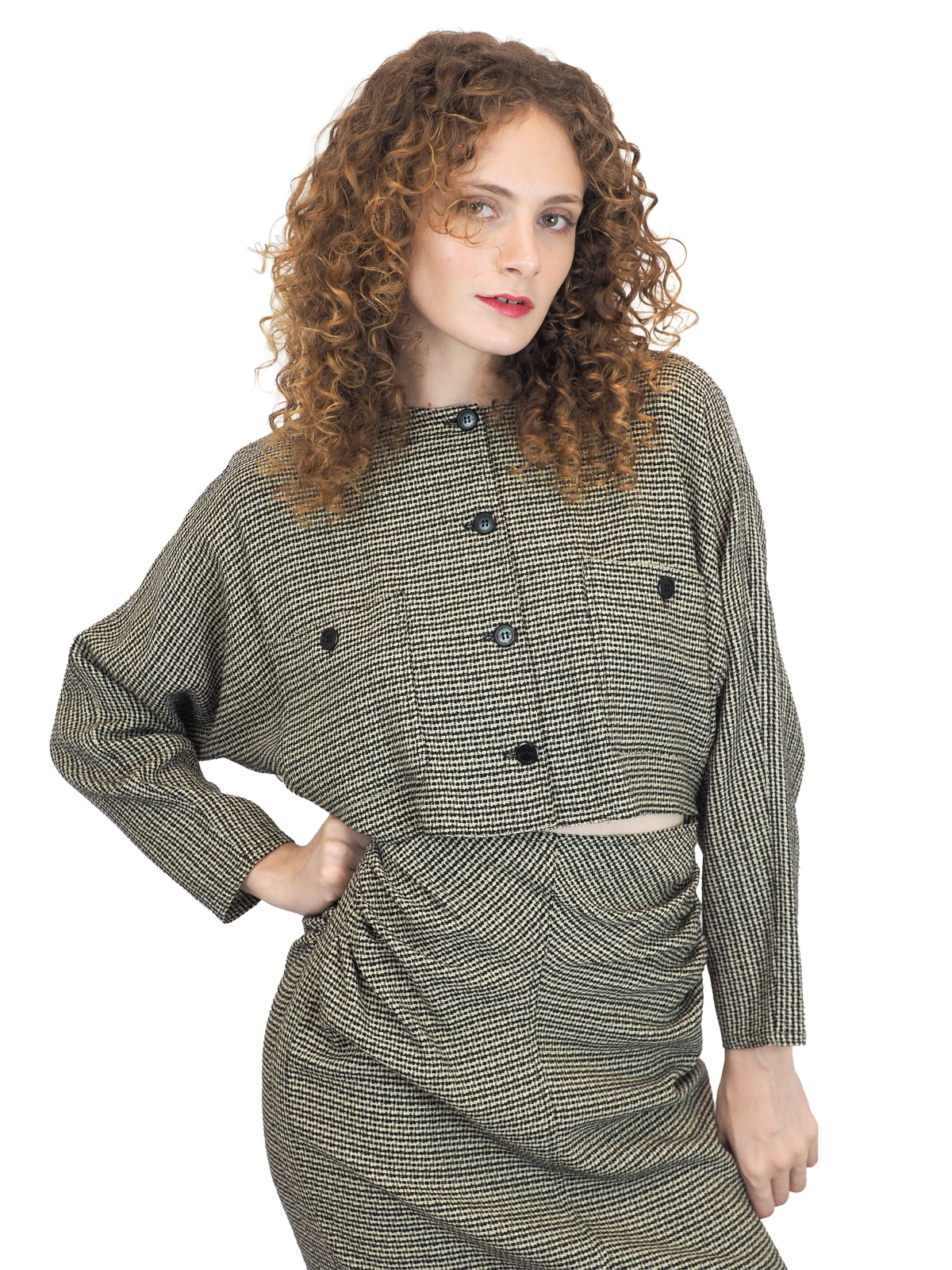 A vintage houndstooth Gucci 1980s checkered mini dress with buttons and a center cut out