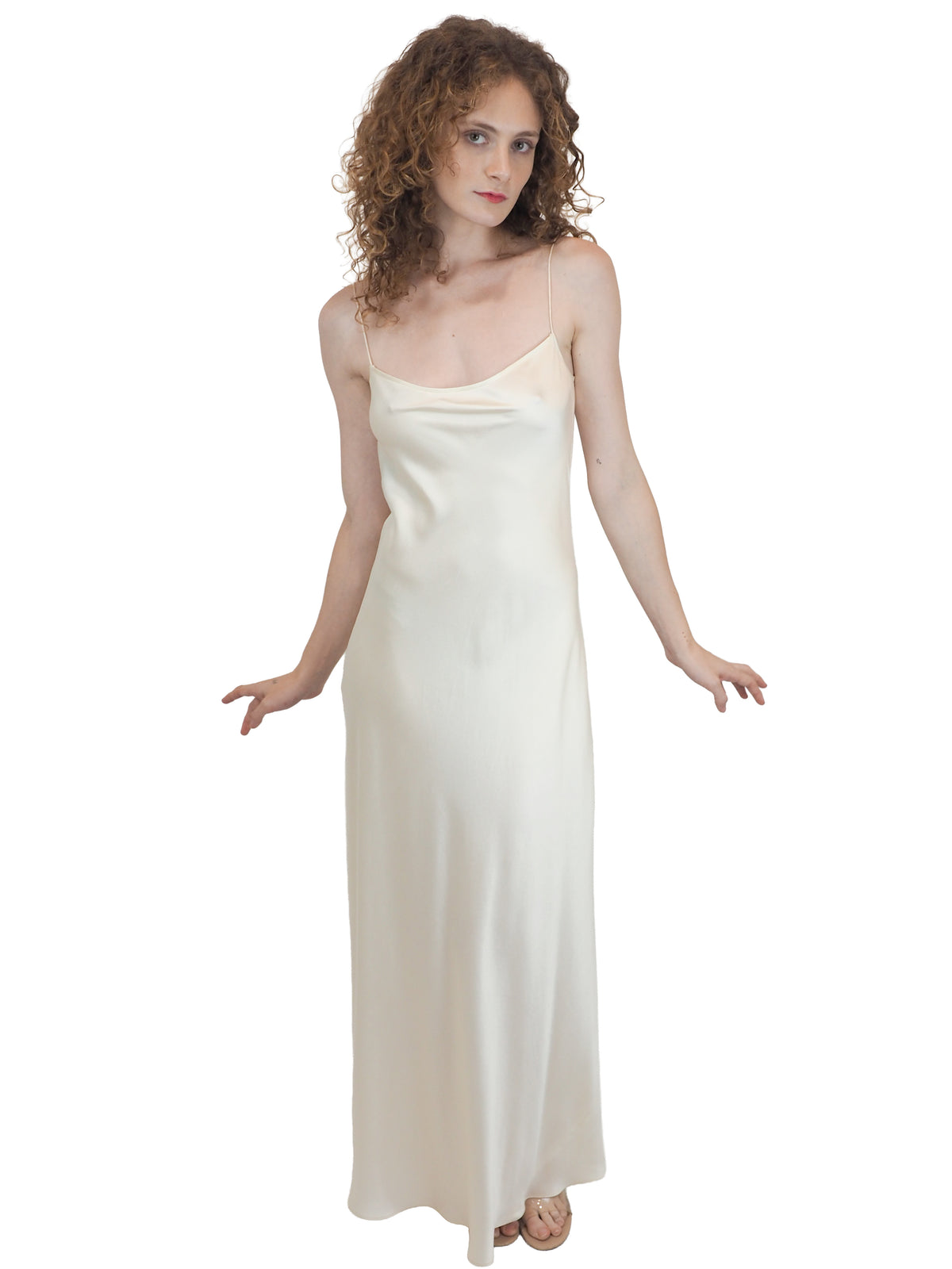 a vintage bridal floor-length, satin silk slip gown in an ivory white color 