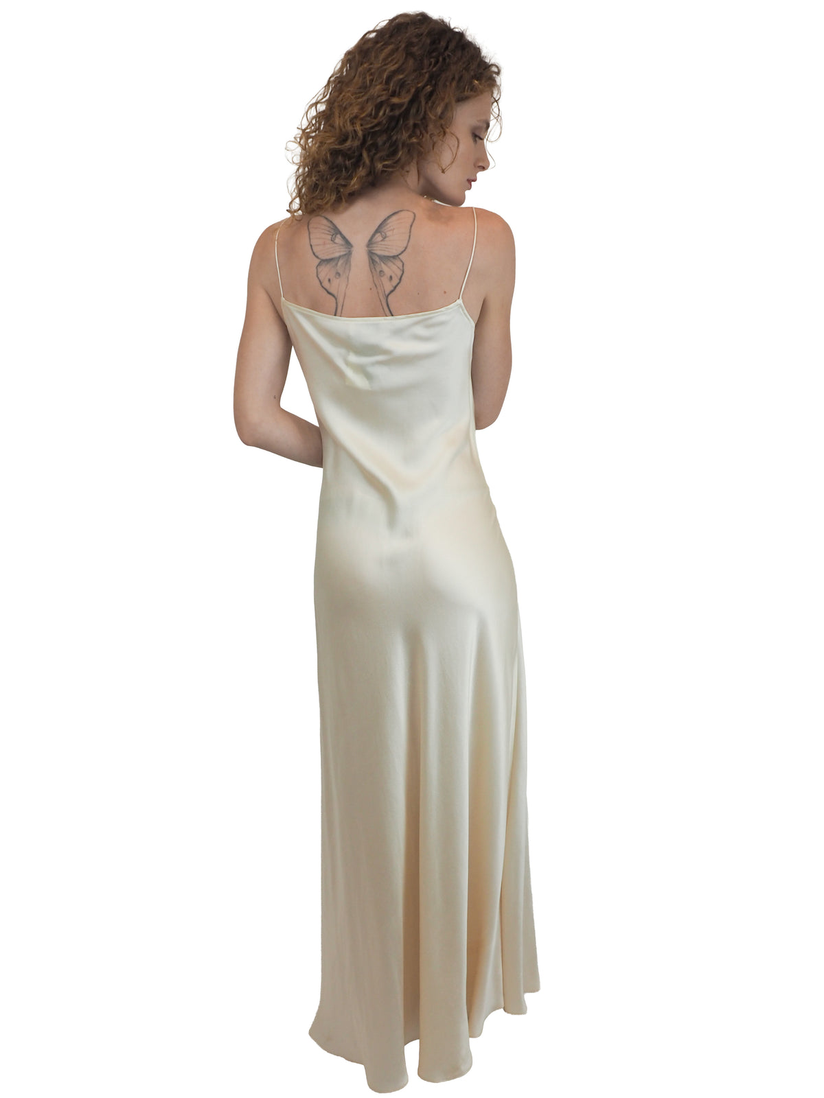a vintage bridal floor-length, satin silk slip gown in an ivory white color 