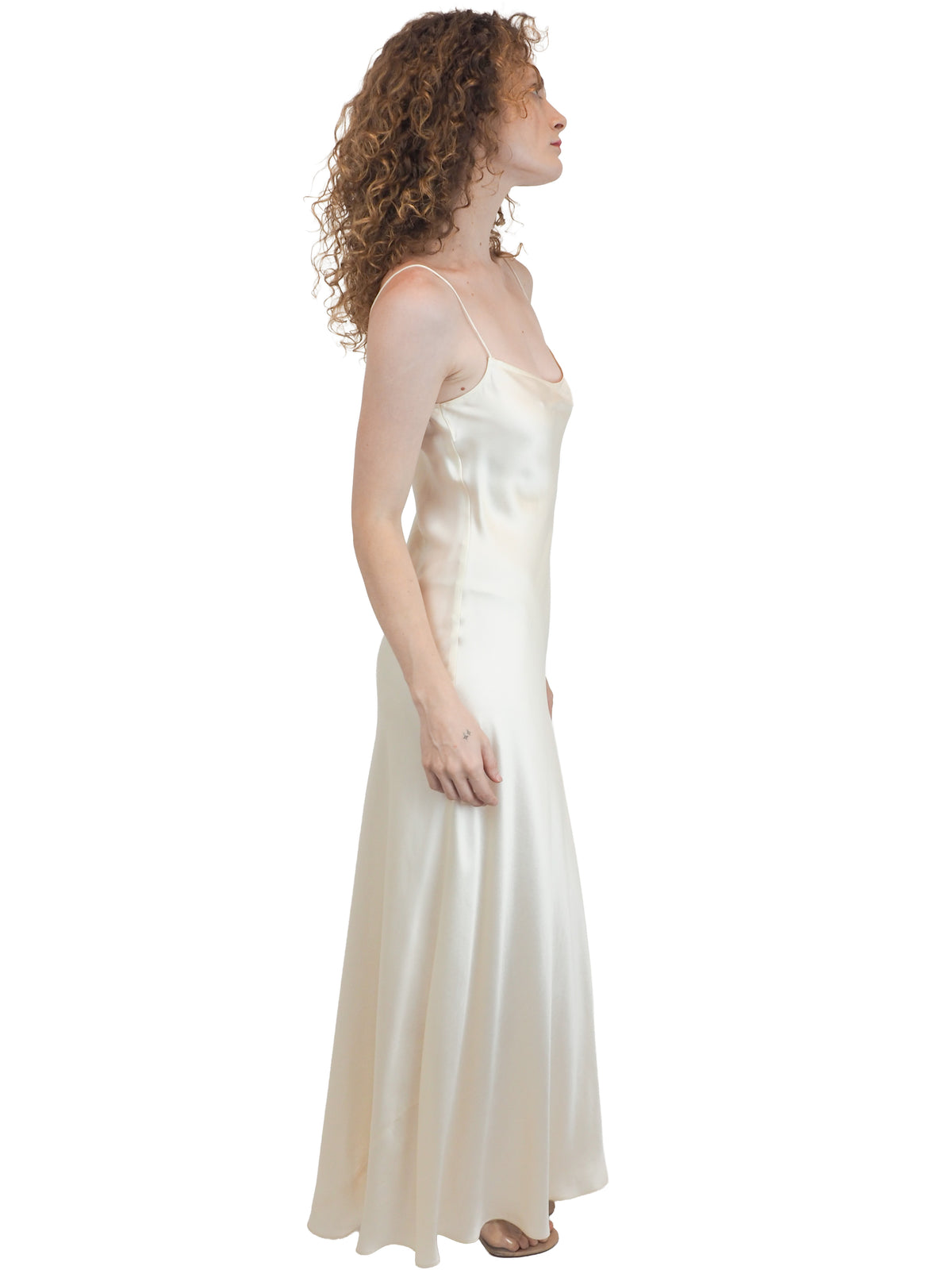 a vintage bridal floor-length, satin silk slip gown in an ivory white color 