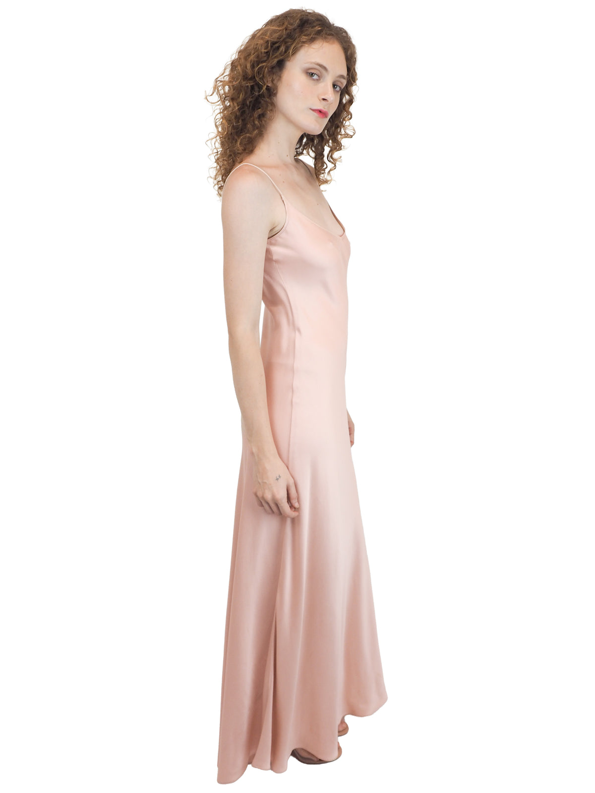 A vintage bridal pale pink satin silk slip dress with spaghetti straps