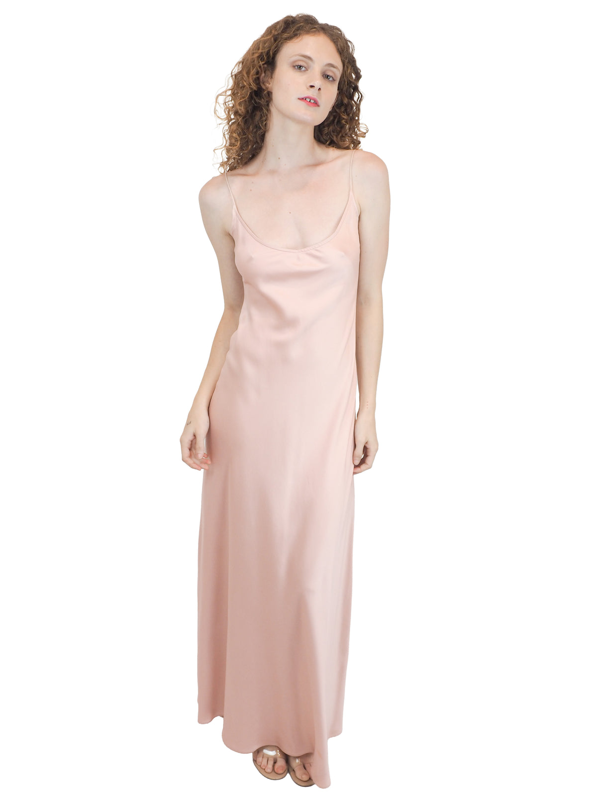 A vintage bridal pale pink satin silk slip dress with spaghetti straps