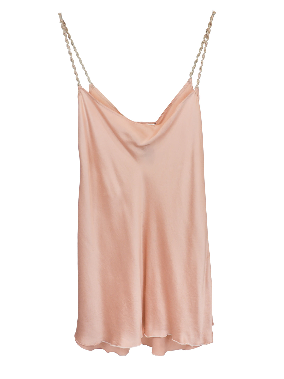 A light peach satin slip dress with thin braided straps