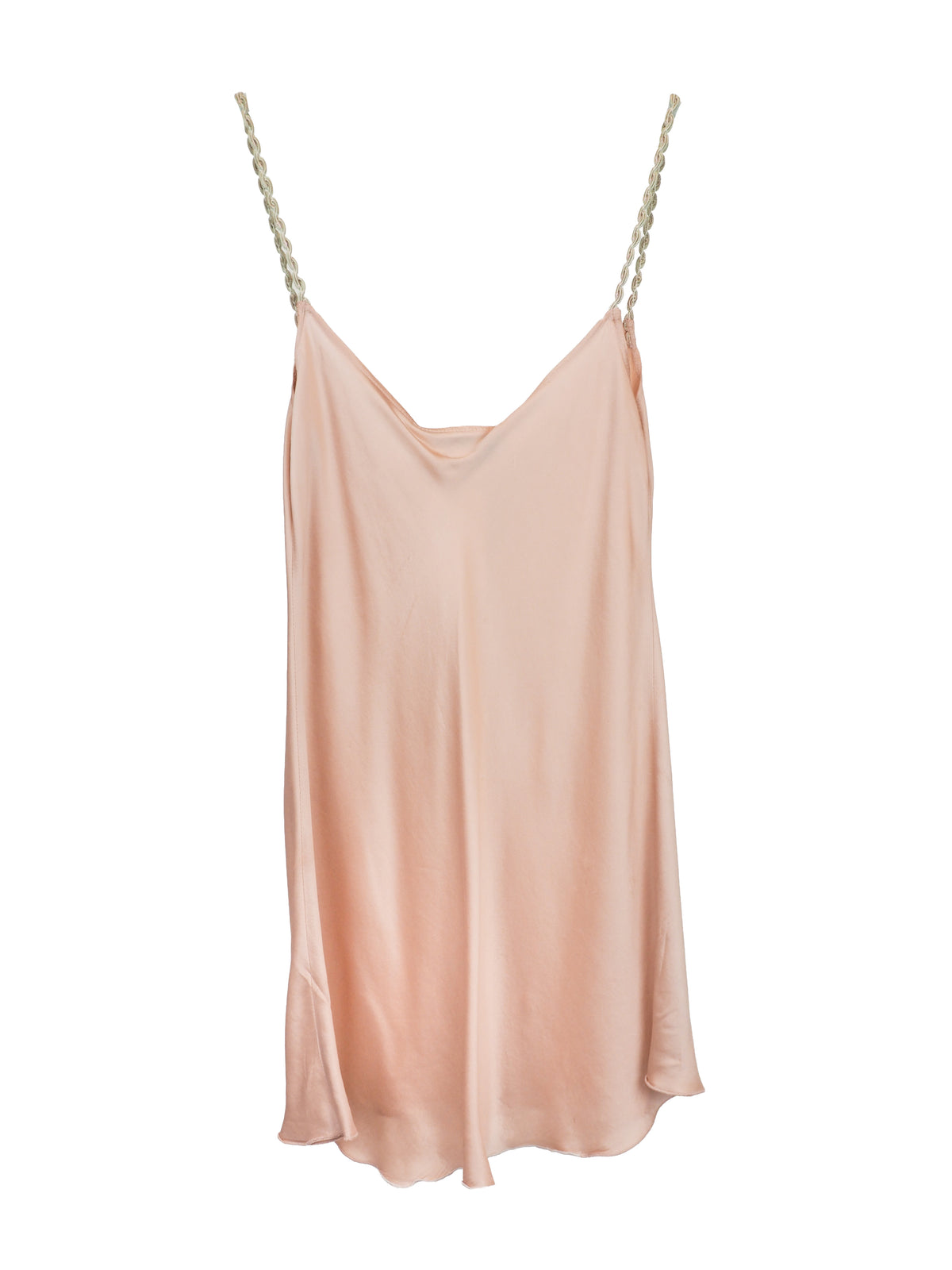 A light peach satin slip dress with thin braided straps