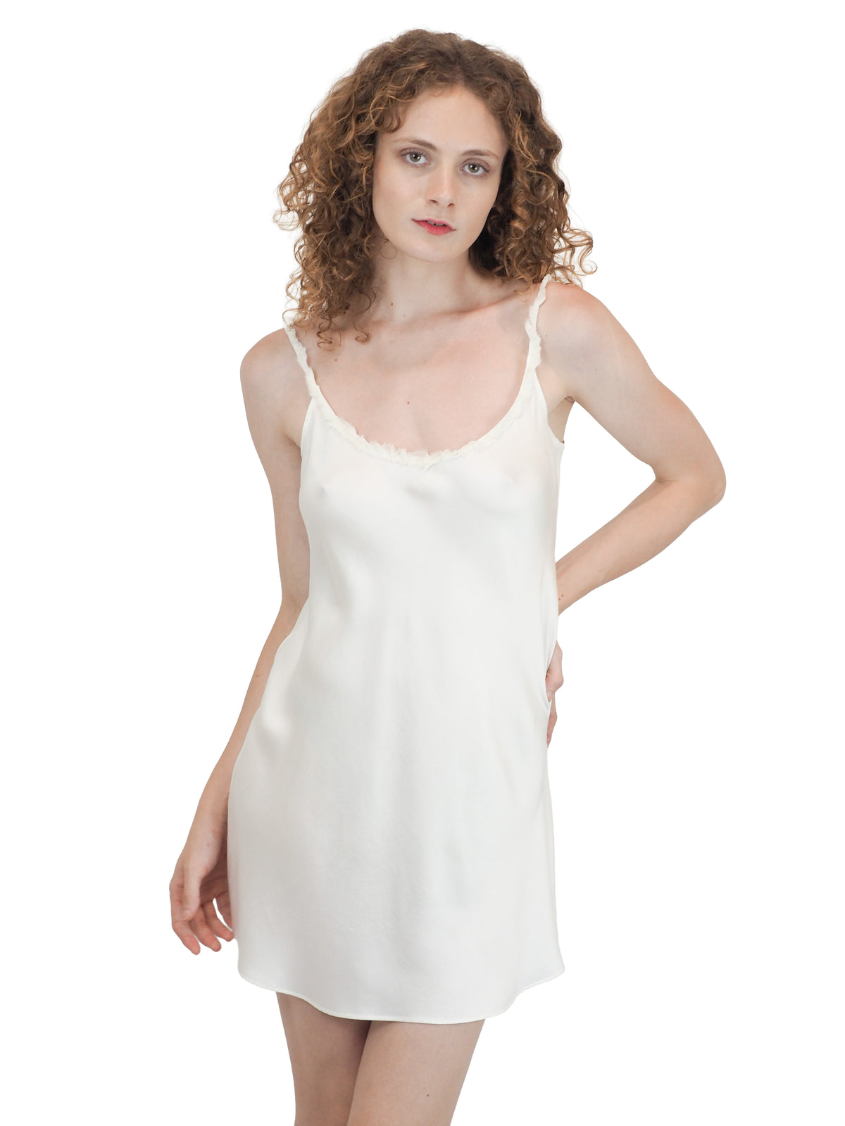 A vintage bridal mini white satin silk slip dress with spaghetti straps