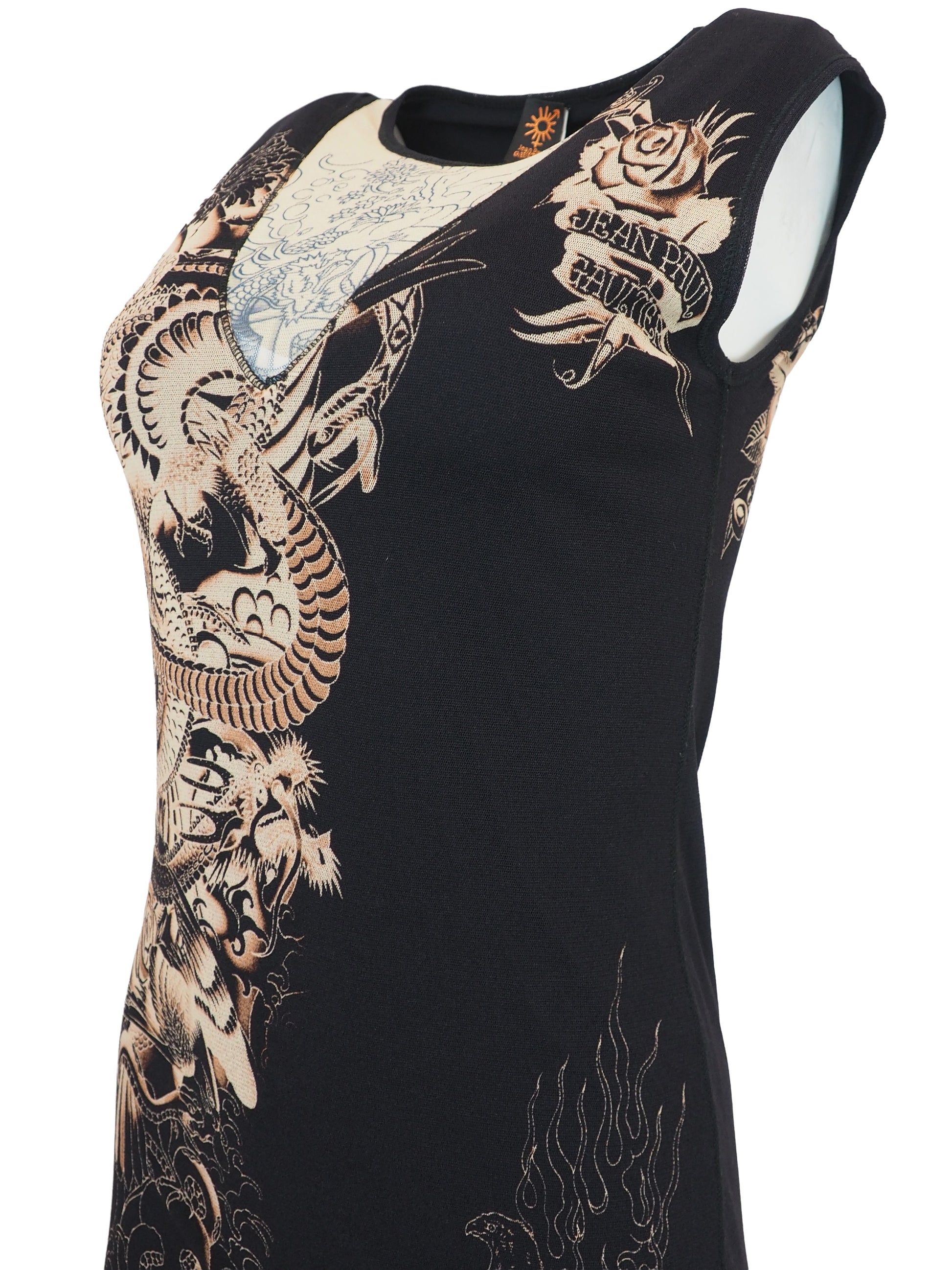 A vintage jean Paul gaultier mesh sleeveless black midi dress featuring a large beige and gold dragon graphic print on the front, with a sheer hem