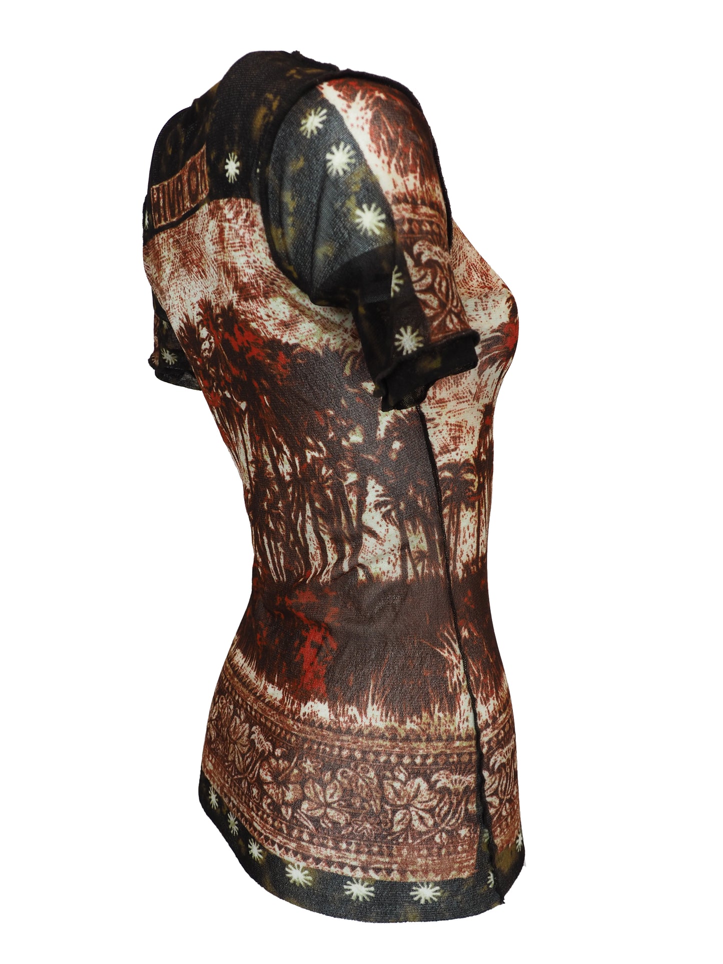 A vintage jean Paul gaultier short-sleeve t-shirt with a distressed, vintage-style graphic print featuring a tropical palm tree scene in shades of red, brown, and beige, with tribal-style patterns on the shoulders and hem.