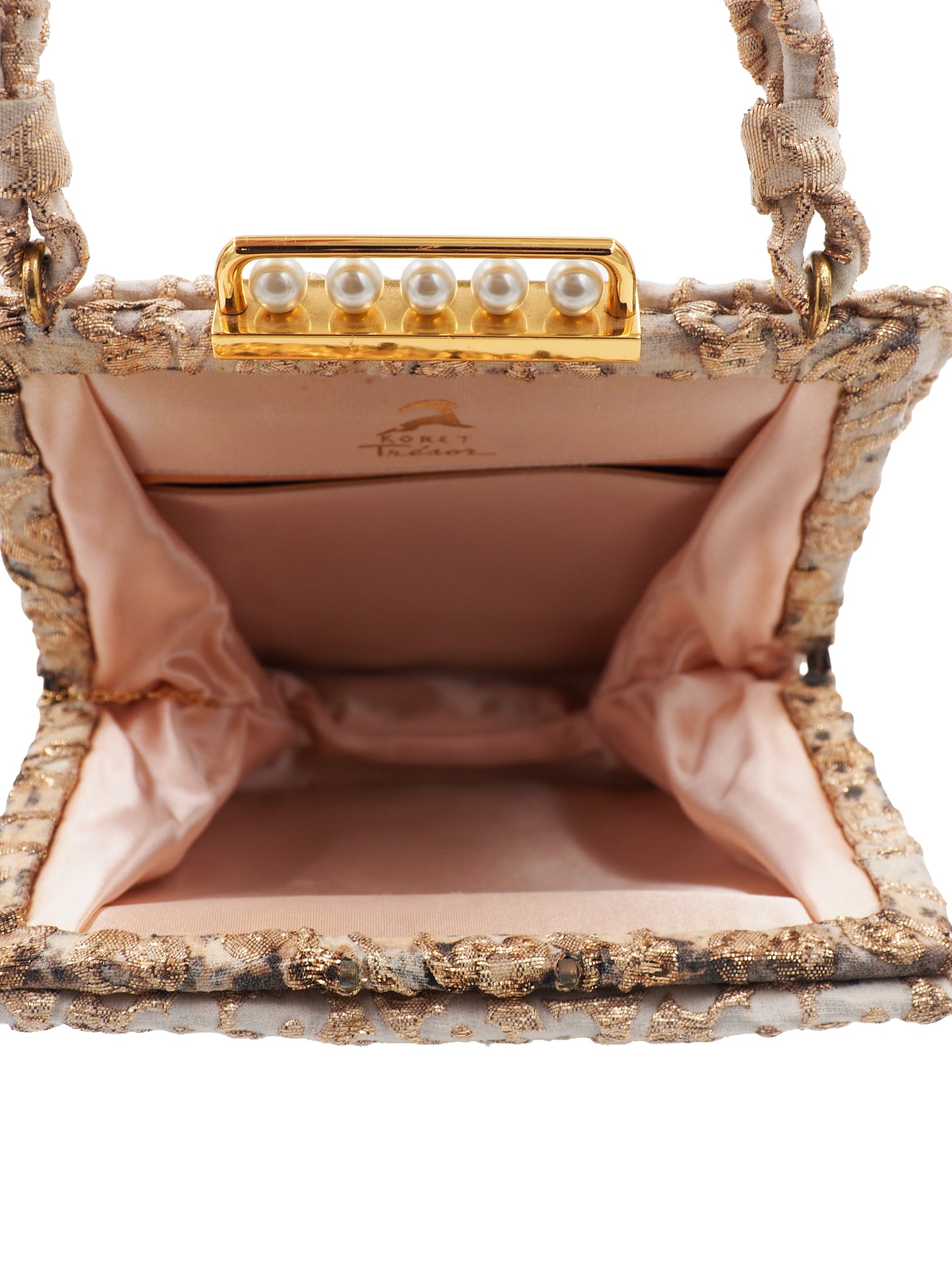 A 1960s Koret vintage structured evening clutch bag in beige and gold lace, featuring a braided top handle and a gold-tone metal clasp adorned with faux pearls