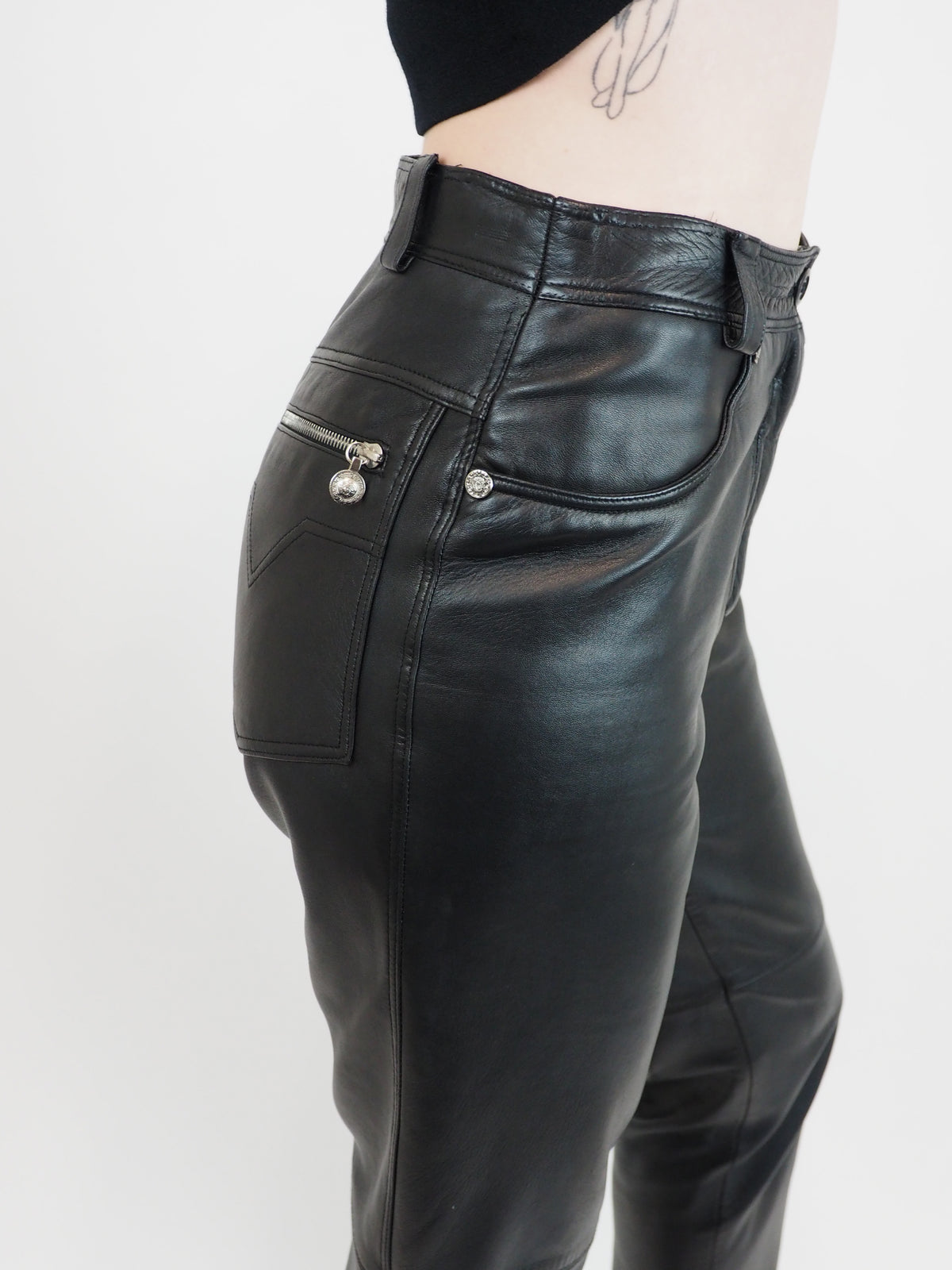Vintage Versace Black leather cropped pants with a straight-leg fit