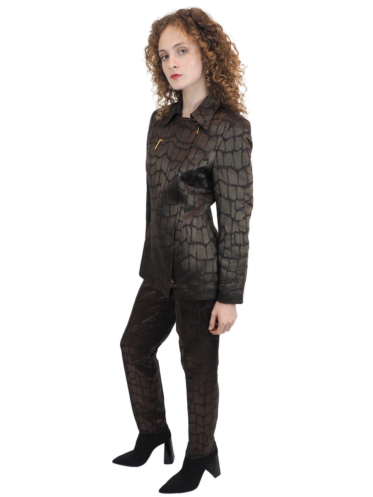 A vintage 1980's Mondi matching dark brown and black textured suit with a collared jacket, mini skirt and trousers