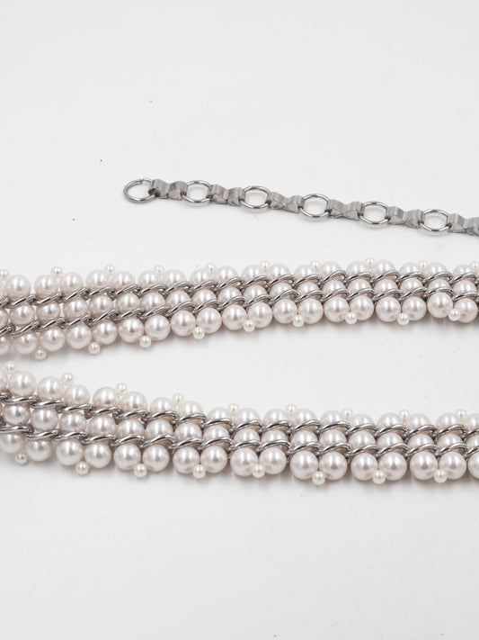 A vintage multi-strand pearl belt with a silver-tone chain extender clasp