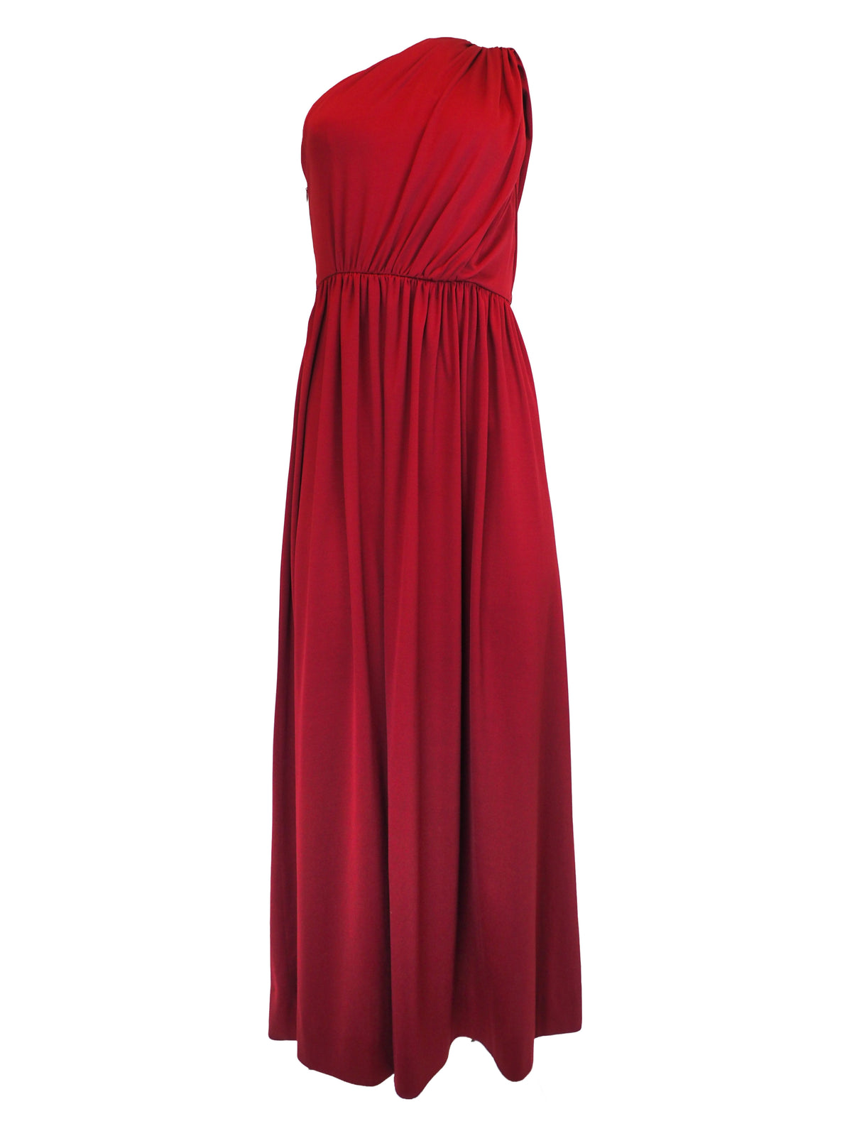 A vintage 1970s red one-shoulder maxi dress with a draped, wrap-style bodice and a matching waist tie