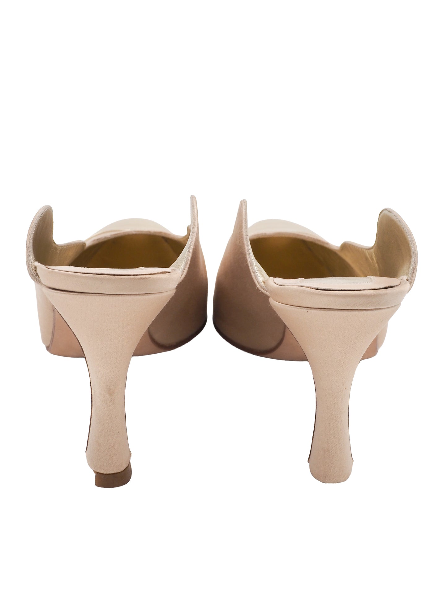 A vintage pair of pointed-toe mule heels in metallic champagne gold and beige, featuring a scalloped edge detail and a slim high heel