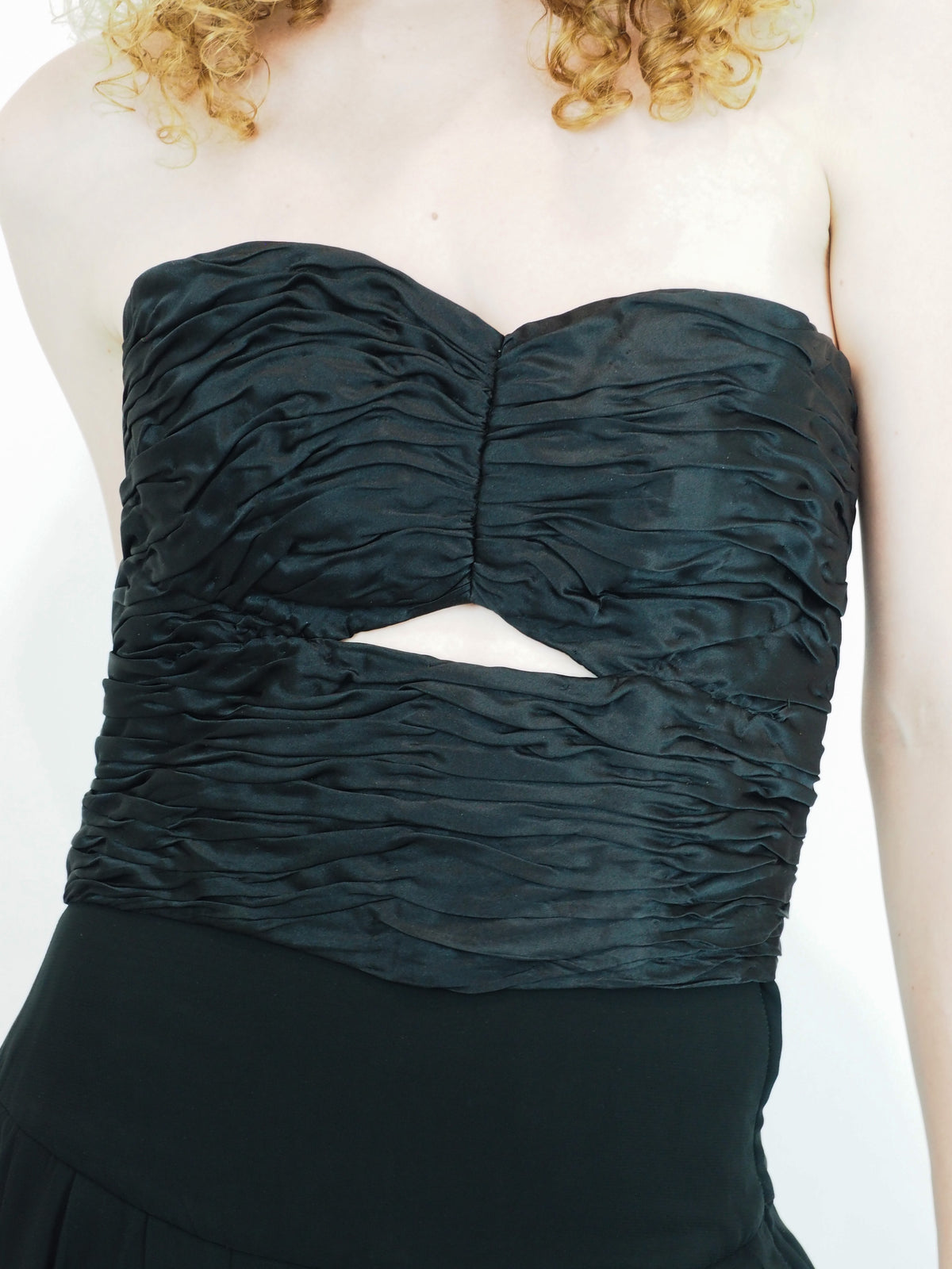 A vintage Ungaro strapless black dress with a textured ruched bustier