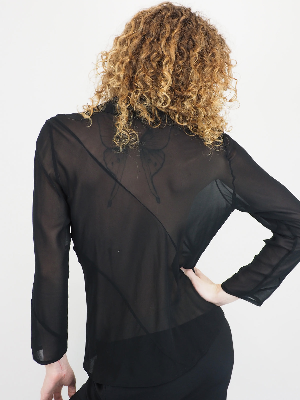 A vintage 90s tom ford for gucci black sheer long-sleeve blouse and a matching black maxi skirt with sheer side panels