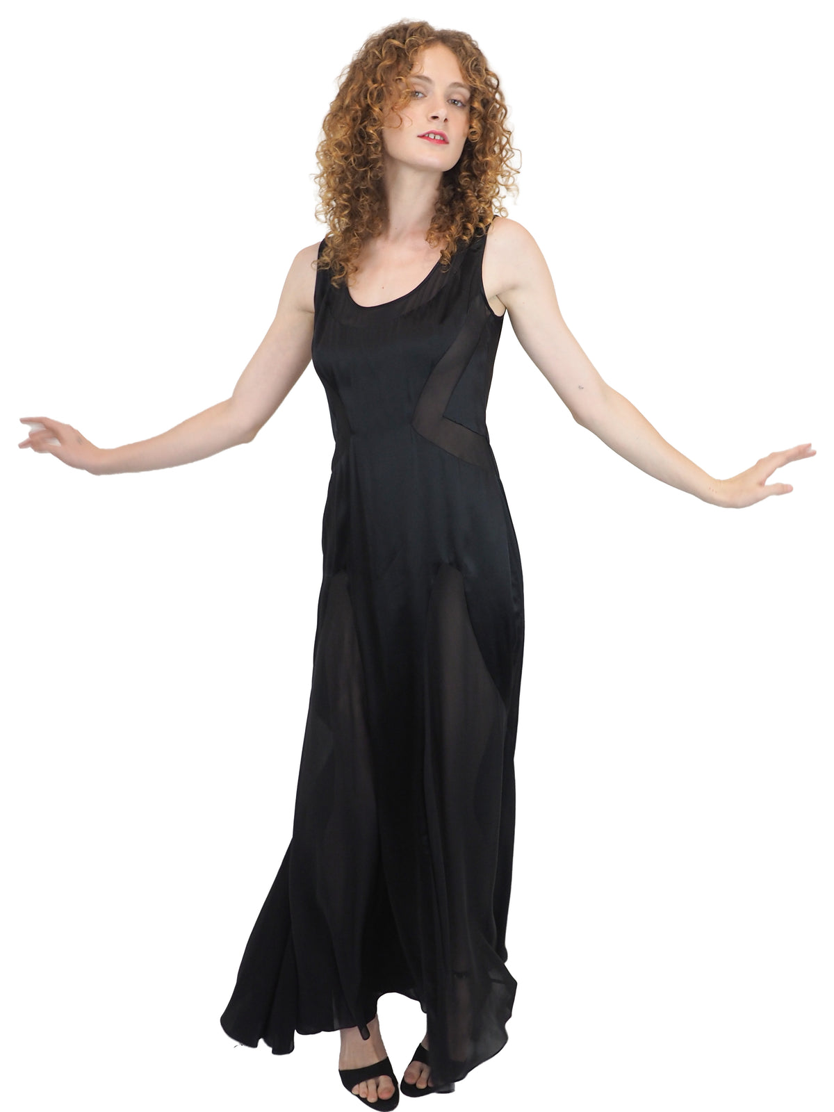 A vintage Versace Y2K 2000s sleeveless black maxi dress or gown with sheer mesh panels