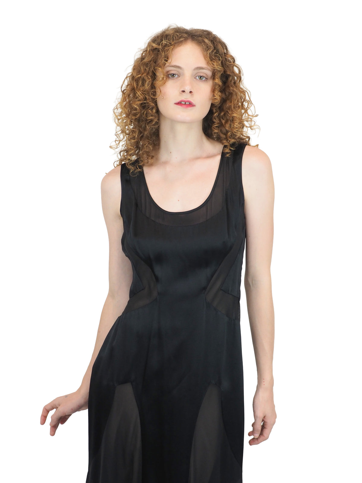 A vintage Versace Y2K 2000s sleeveless black maxi dress or gown with sheer mesh panels