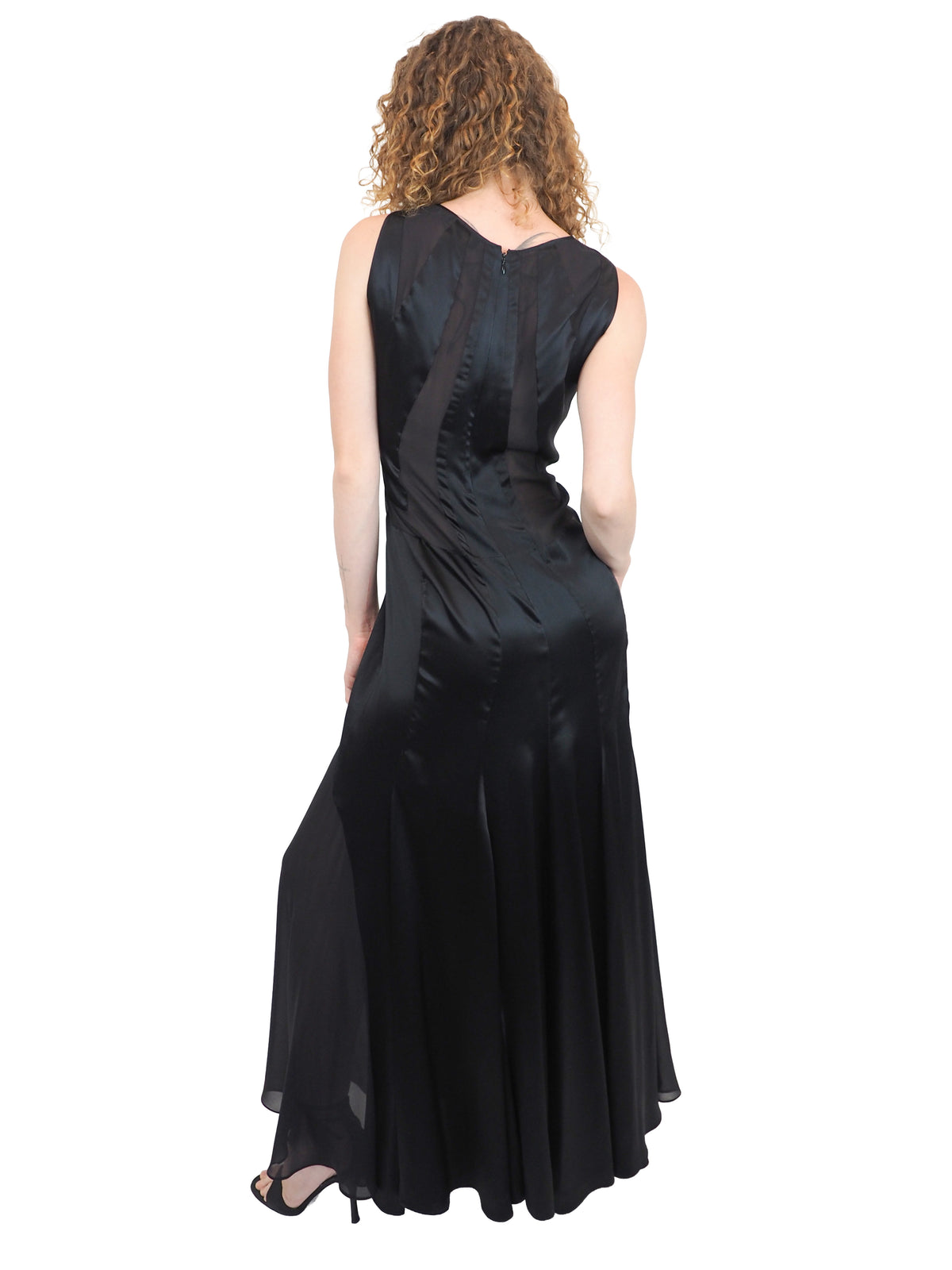 A vintage Versace Y2K 2000s sleeveless black maxi dress or gown with sheer mesh panels
