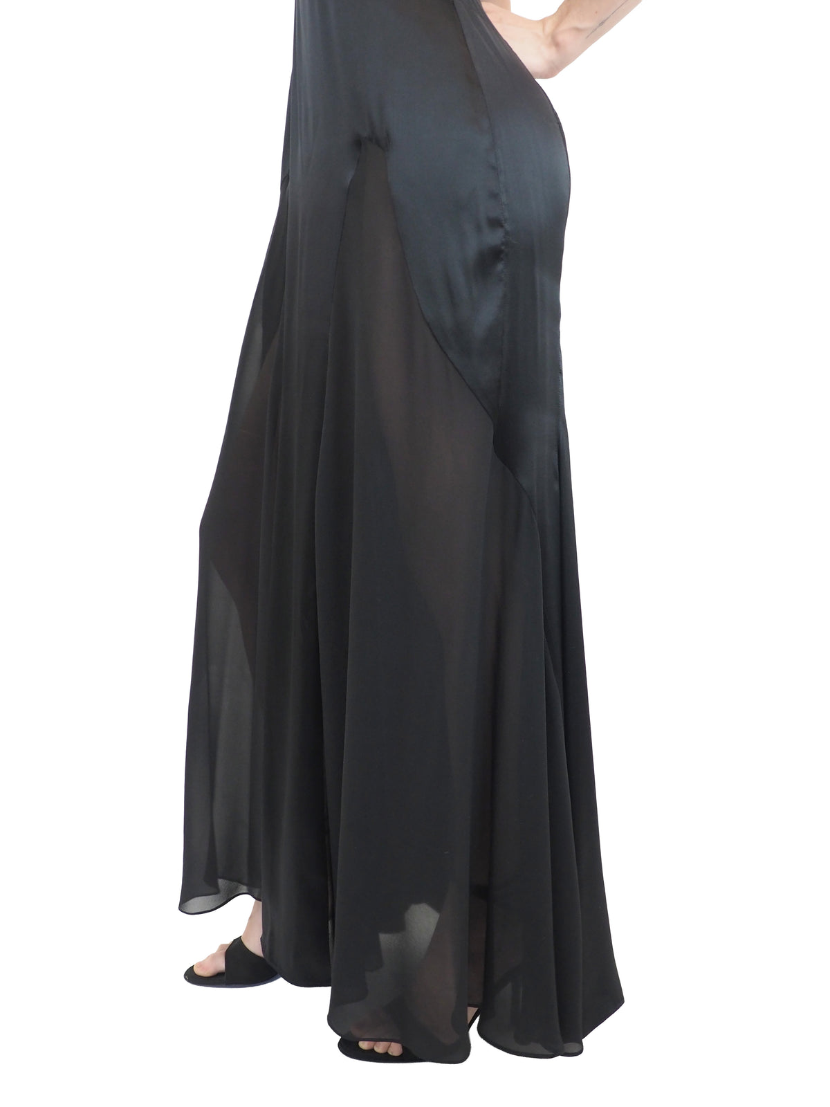 A vintage Versace Y2K 2000s sleeveless black maxi dress or gown with sheer mesh panels