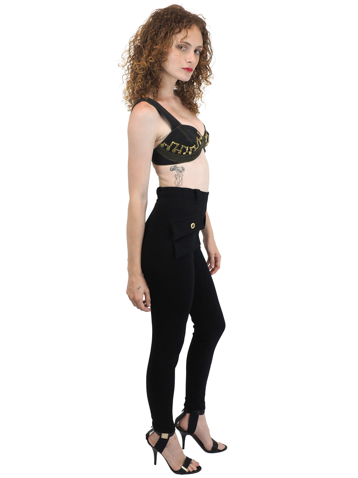 Black vintage Versace high-waisted skinny pants with flap pockets and gold medusa button details
