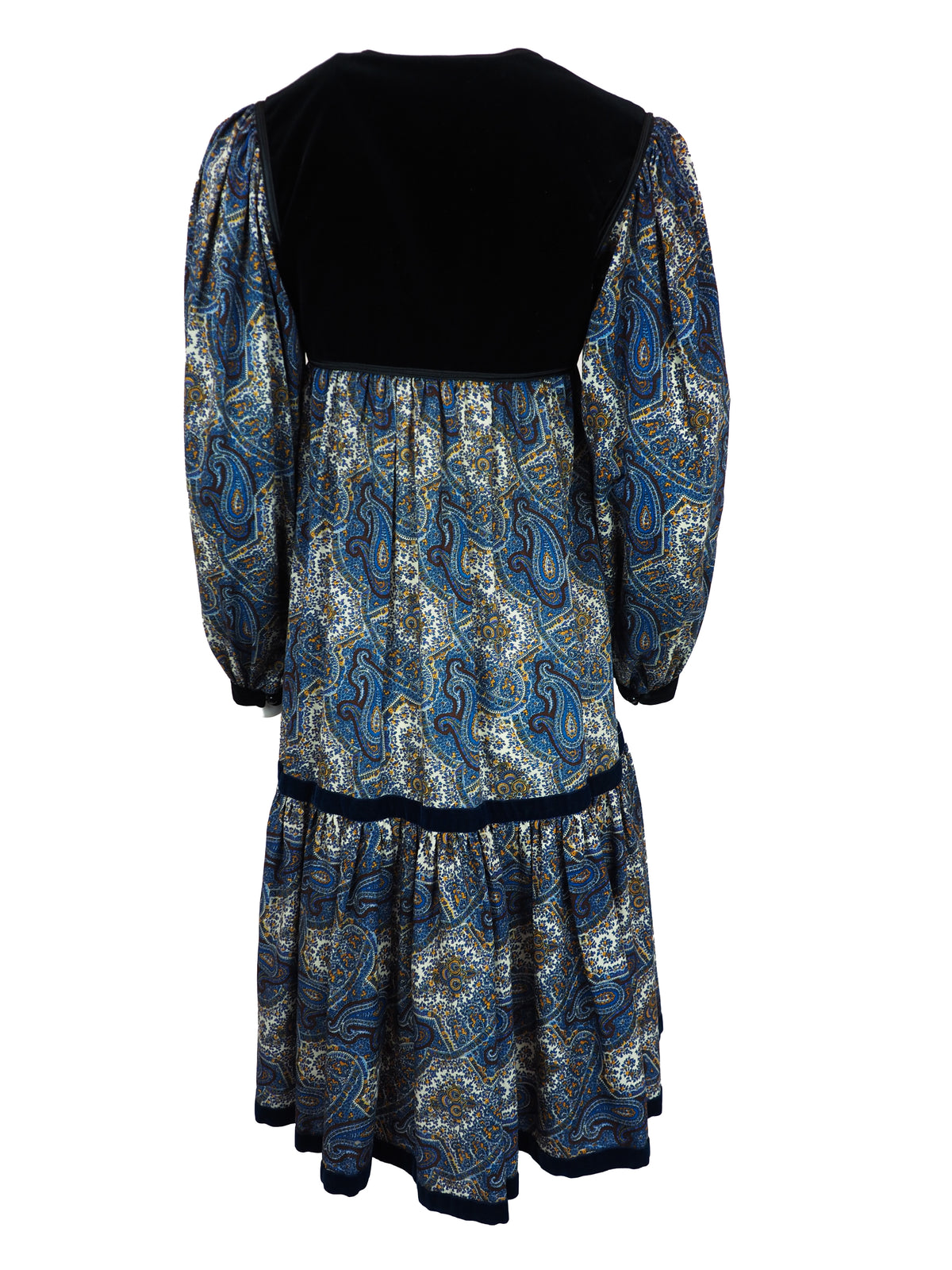 A 1976 Yves Saint Laurent Ballet Russes  long-sleeve midi dress with a black velvet yoke and cuffs, and a blue, gold, and white paisley patterned skirt