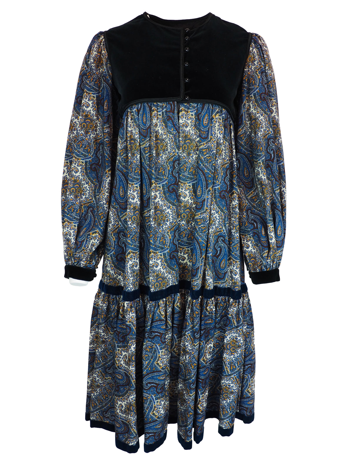 A 1976 Yves Saint Laurent Ballet Russes  long-sleeve midi dress with a black velvet yoke and cuffs, and a blue, gold, and white paisley patterned skirt