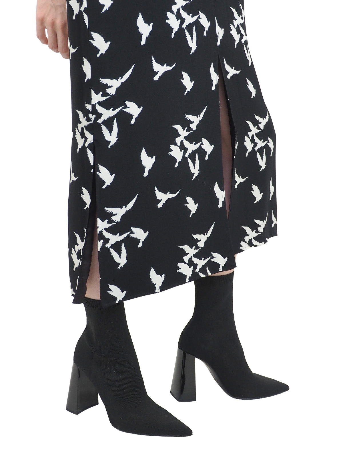 A vintage Yves Saint Laurent YSL 1970's black short-sleeve midi dress with a white bird pattern