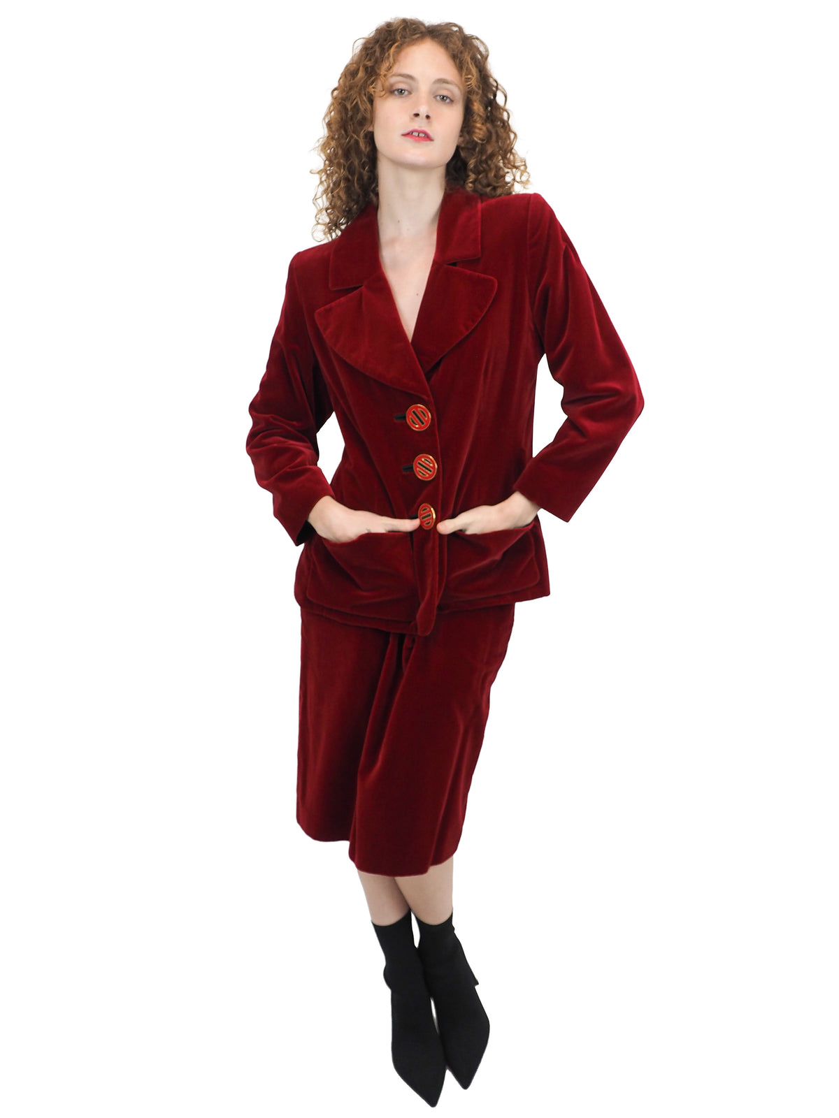 A vintage YSL matching deep red velvet blazer with graphic buttons and skirt set