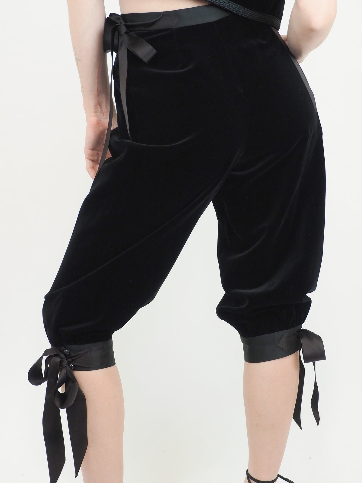 A vintage Yves Saint Laurent YSL 1970's  black velvet sleeveless vest and matching black velvet cropped pants with side ties