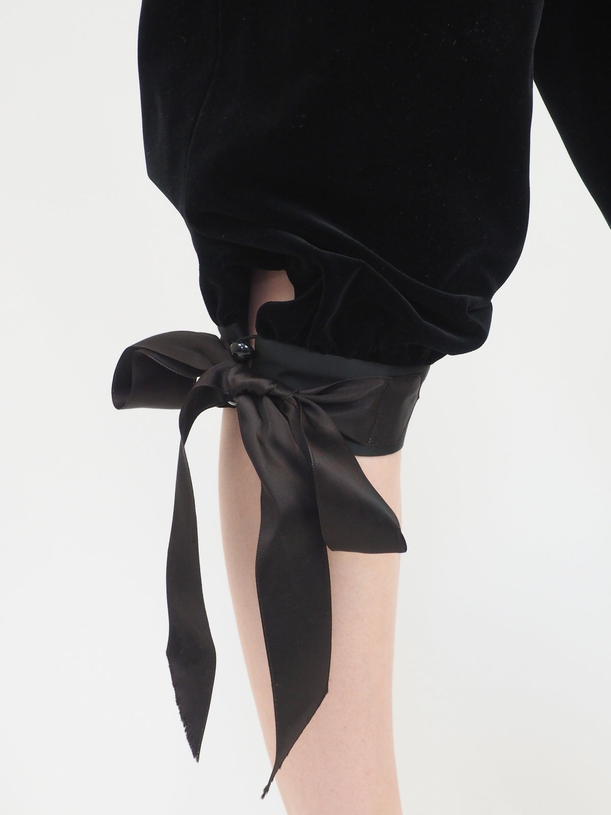 A vintage Yves Saint Laurent YSL 1970's  black velvet sleeveless vest and matching black velvet cropped pants with side ties