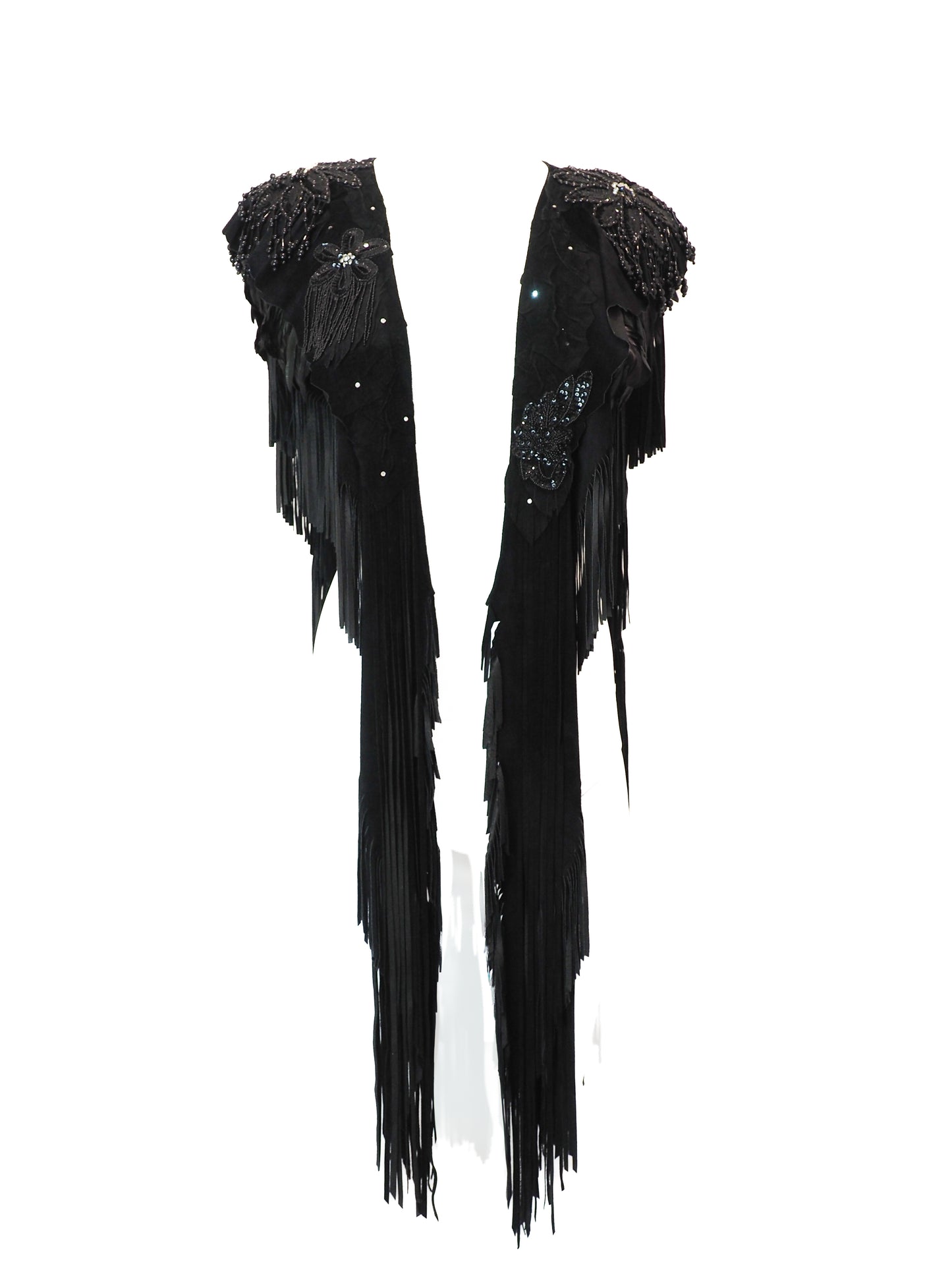 Black fringe garment with sequin details on a white background
