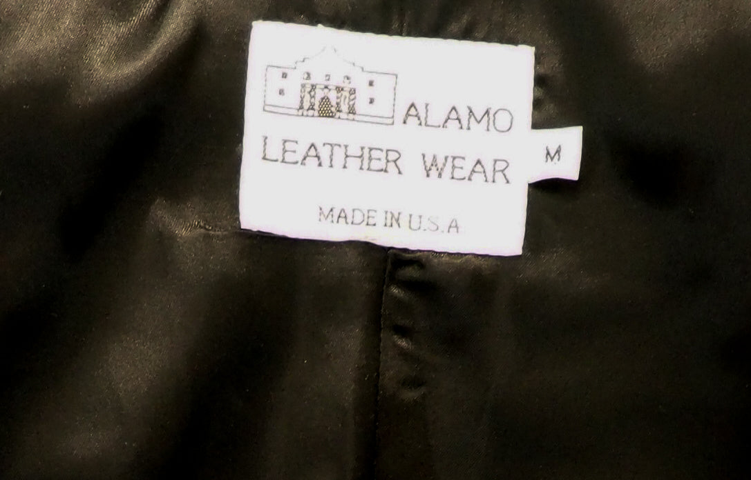 Label on a leather jacket indicating 'Alamo Leather Wear' and 'Made in U.S.A.'