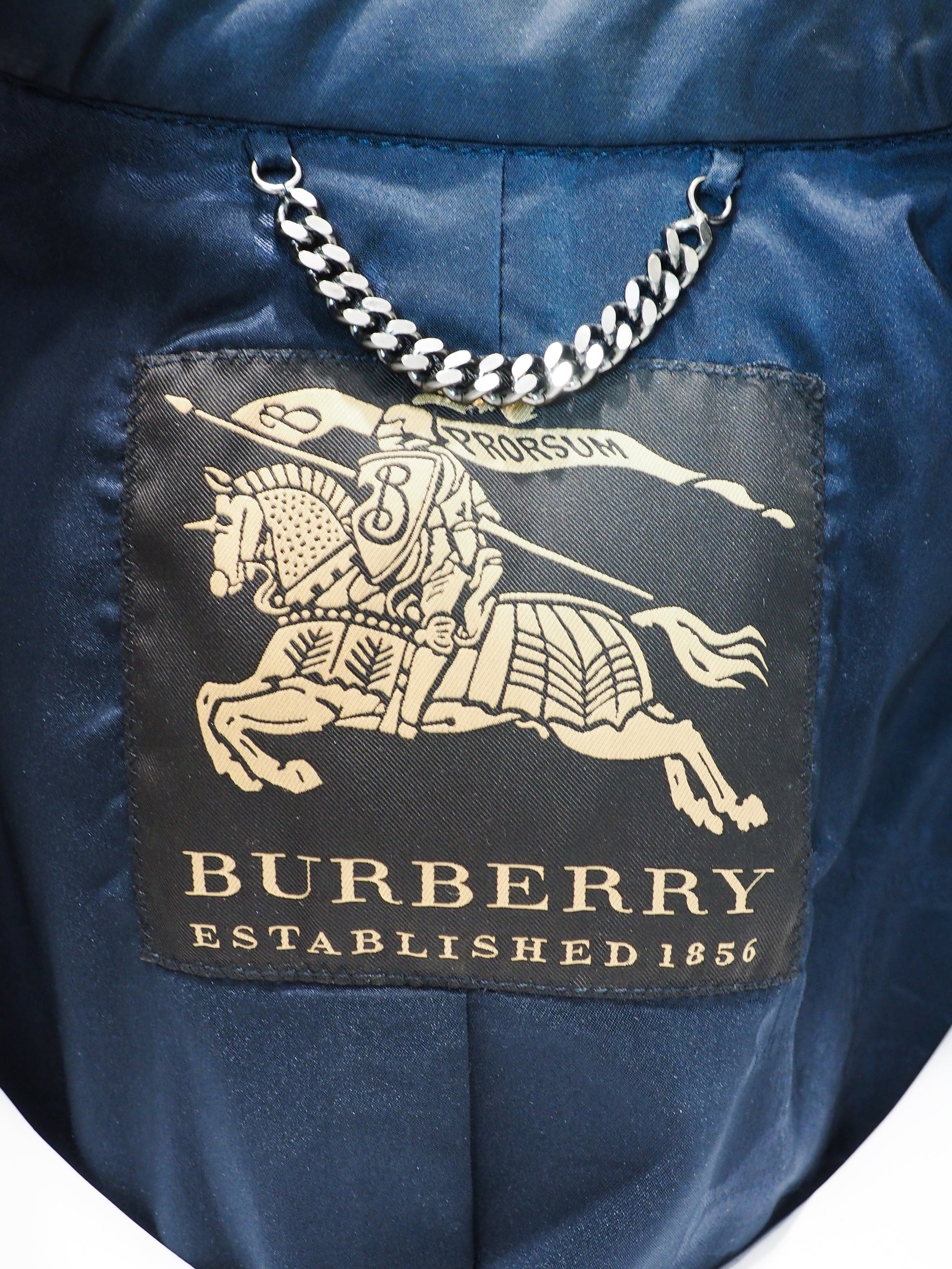 Burberry logo on a blue fabric background