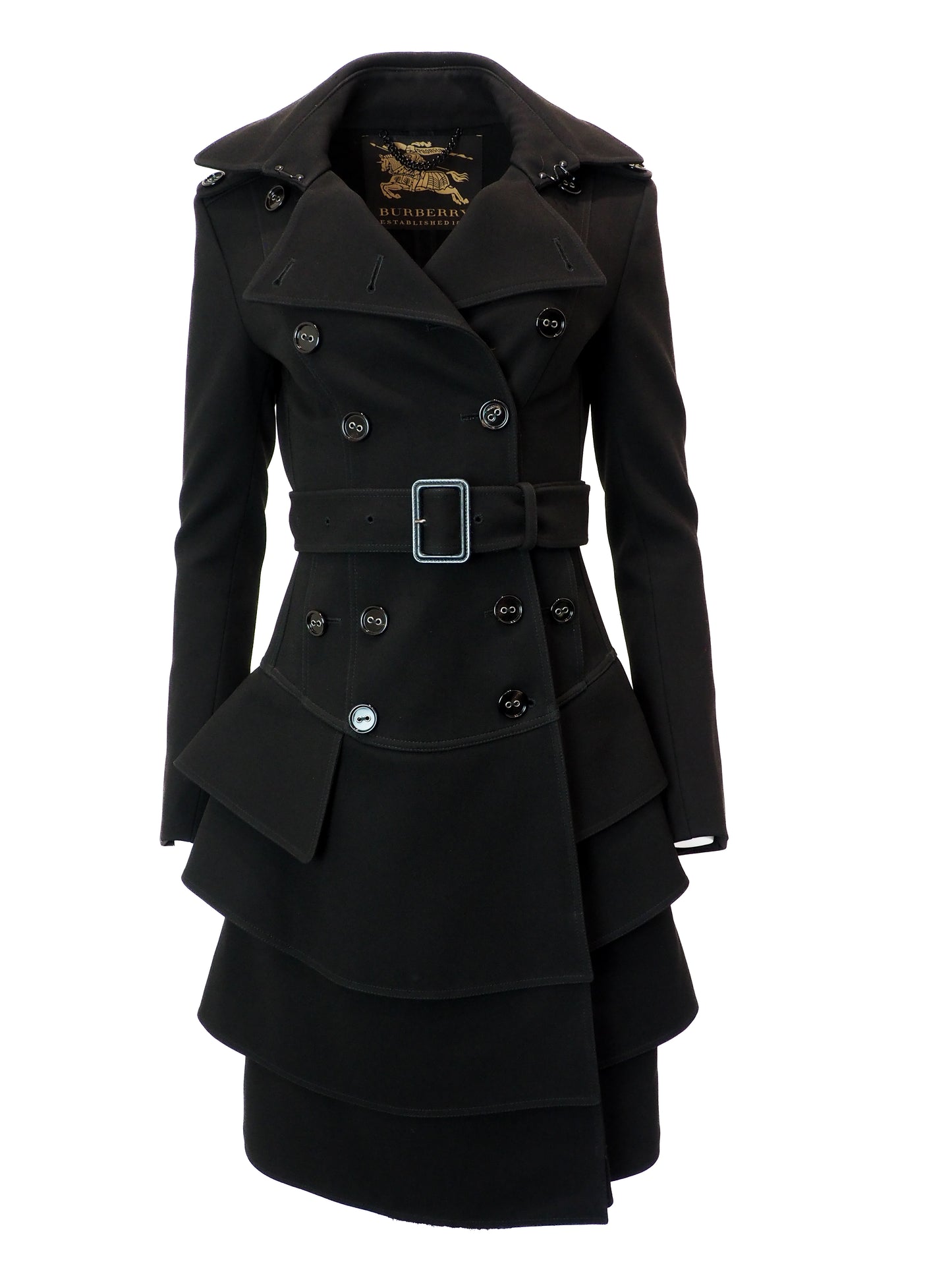 Black coat with a belt and layered skirt design on a white background