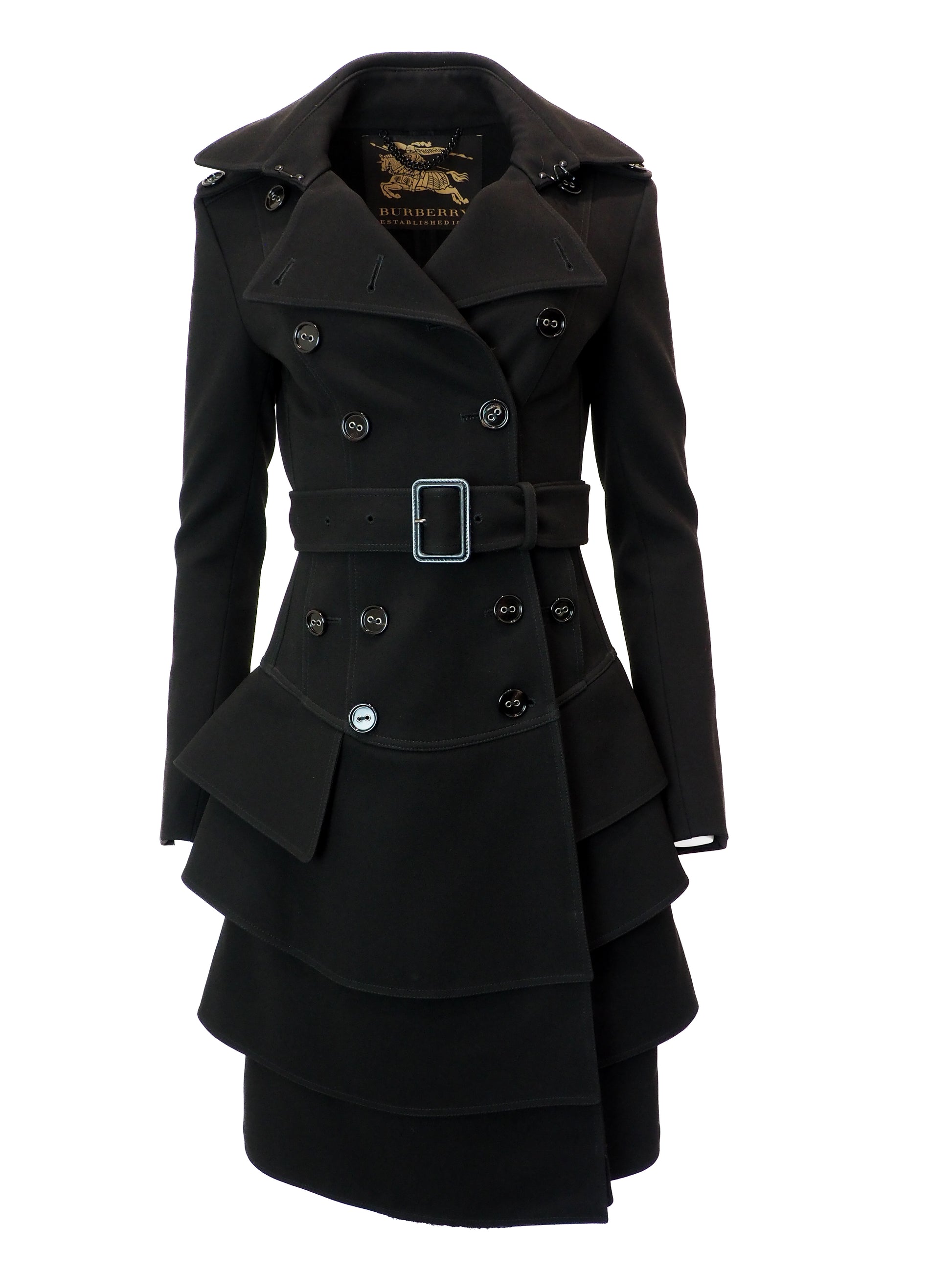 Black coat with a belt and layered skirt design on a white background