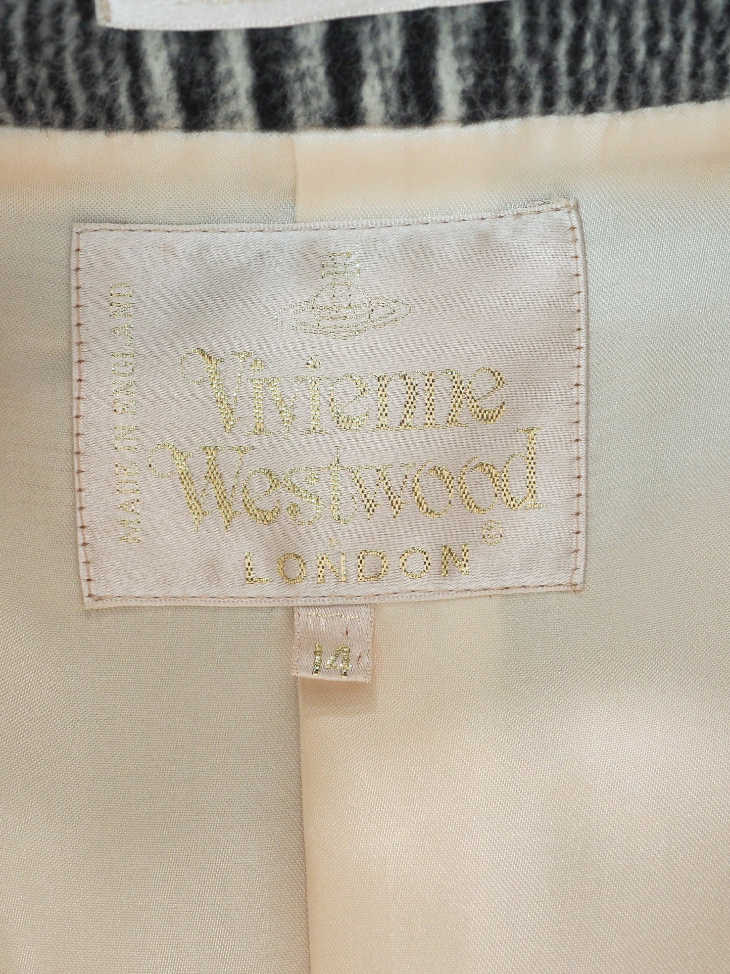 Vivienne Westwood London label on a garment with a neutral background