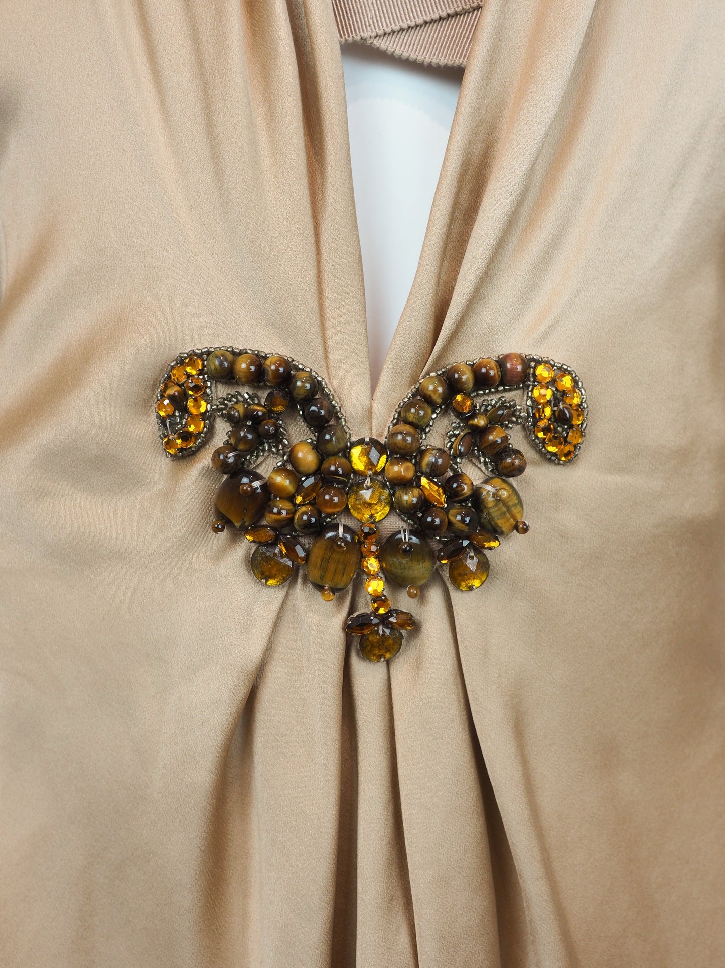 A vintage Alberta ferreti beige satin halter top with a draped neckline and a decorative jeweled embellishment at the center front