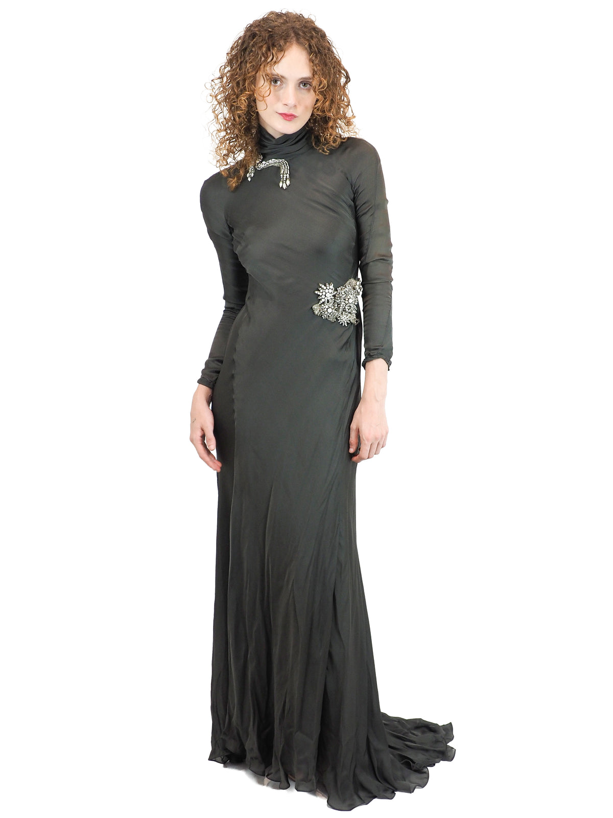 A vintage Alberta Ferretti floor-length green turtleneck gown with long sleeves and silver embellished details on the chest and waist