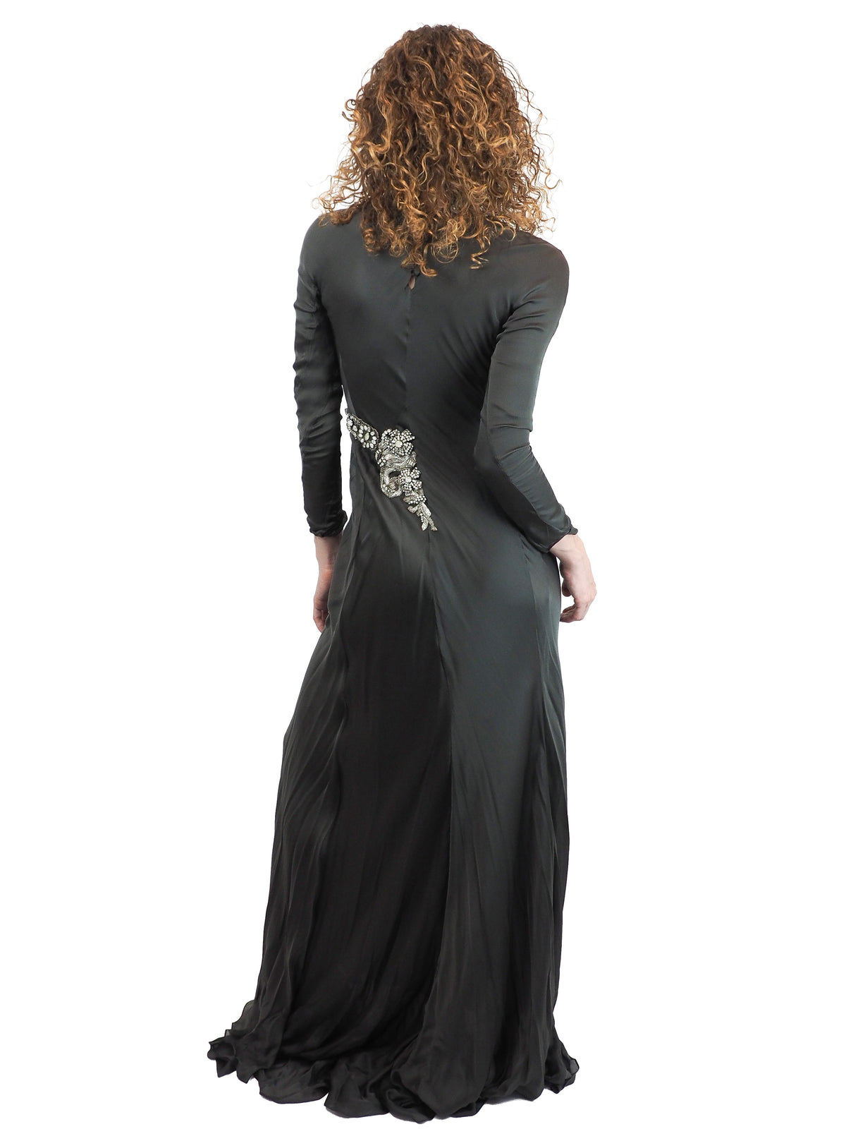 A vintage Alberta Ferretti floor-length green turtleneck gown with long sleeves and silver embellished details on the chest and waist